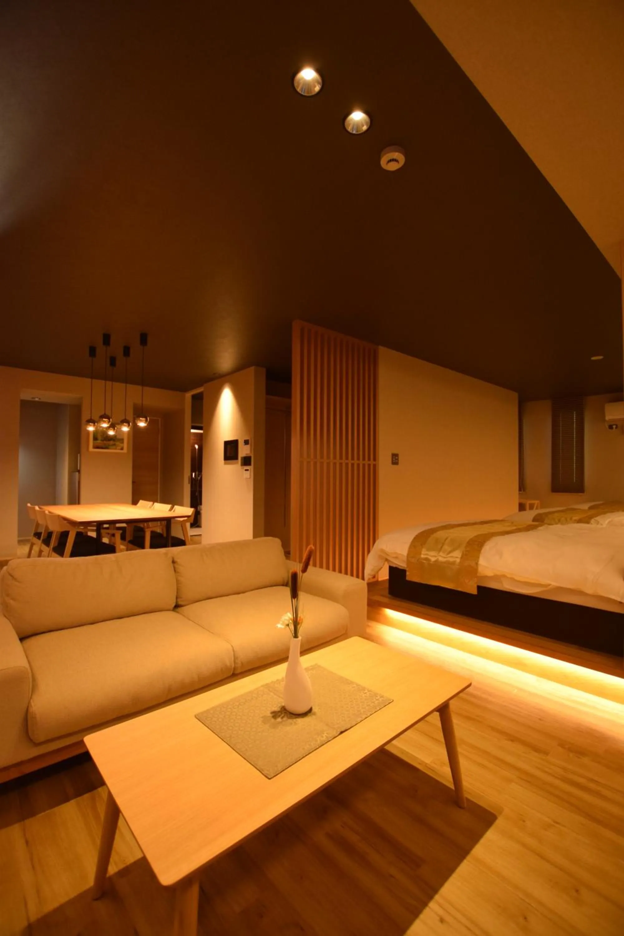 Photo of the whole room, Bed in GRAND BASE Beppu Ekimae