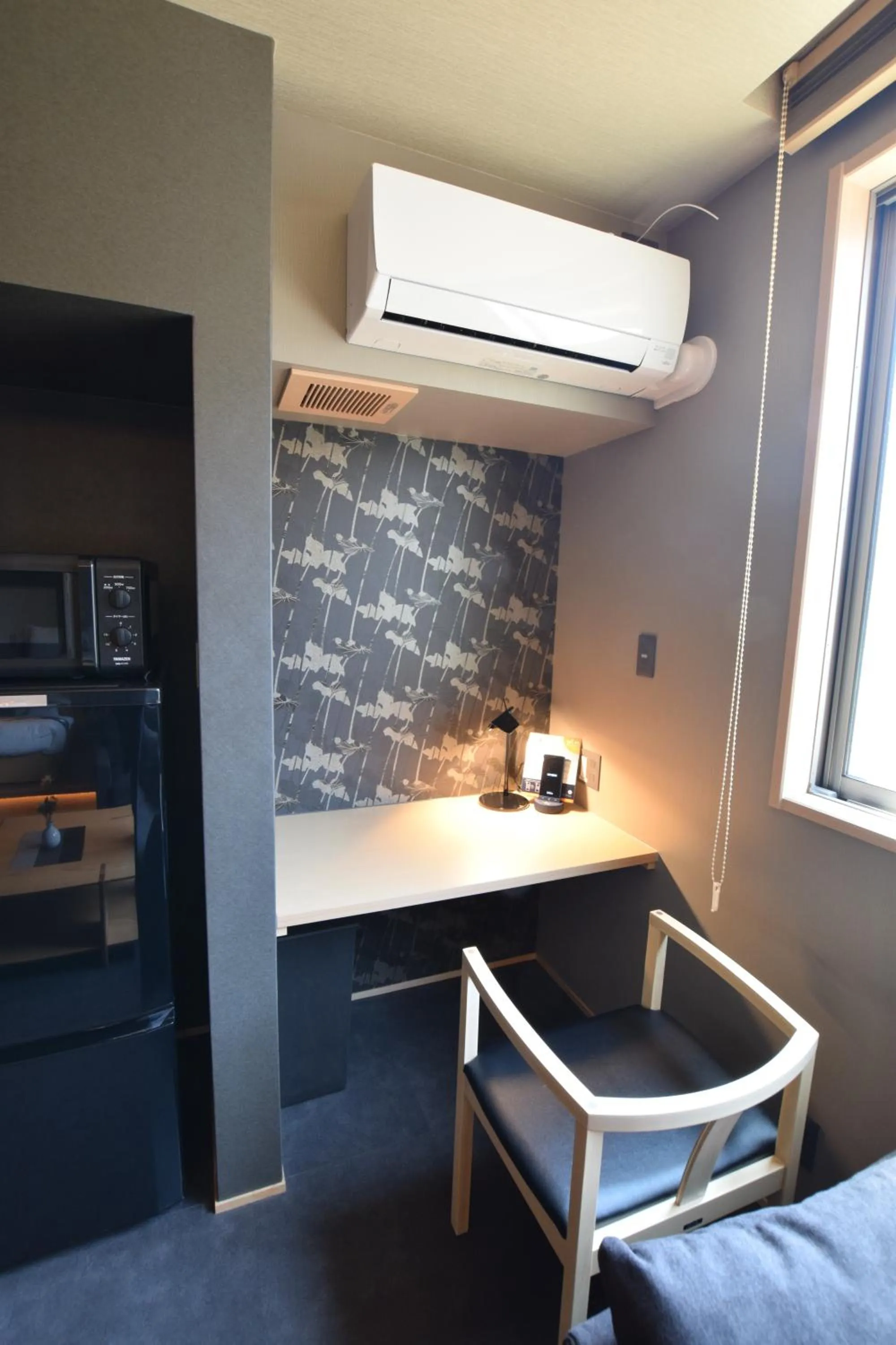 Photo of the whole room in GRAND BASE Beppu Ekimae