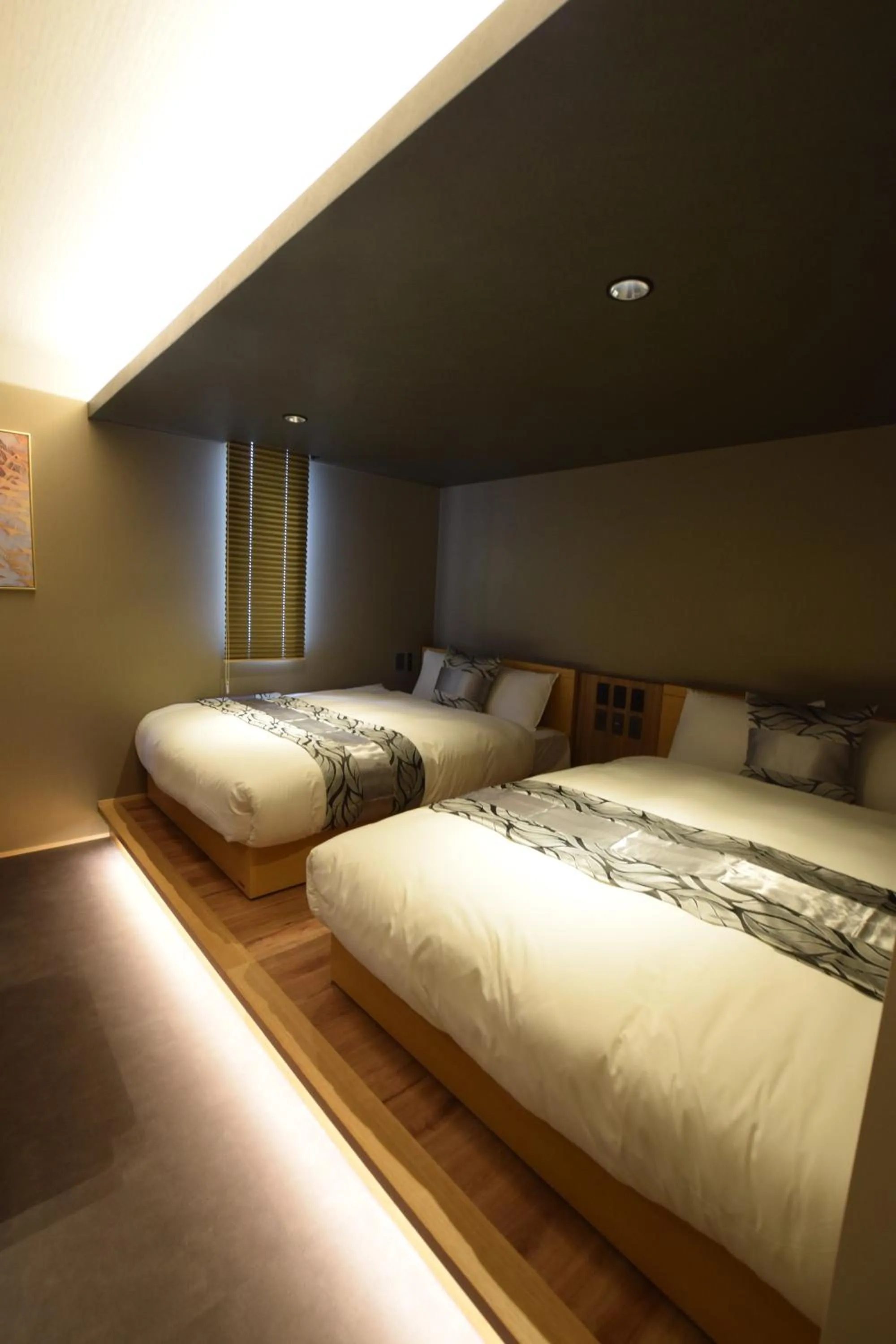 Bed in GRAND BASE Beppu Ekimae