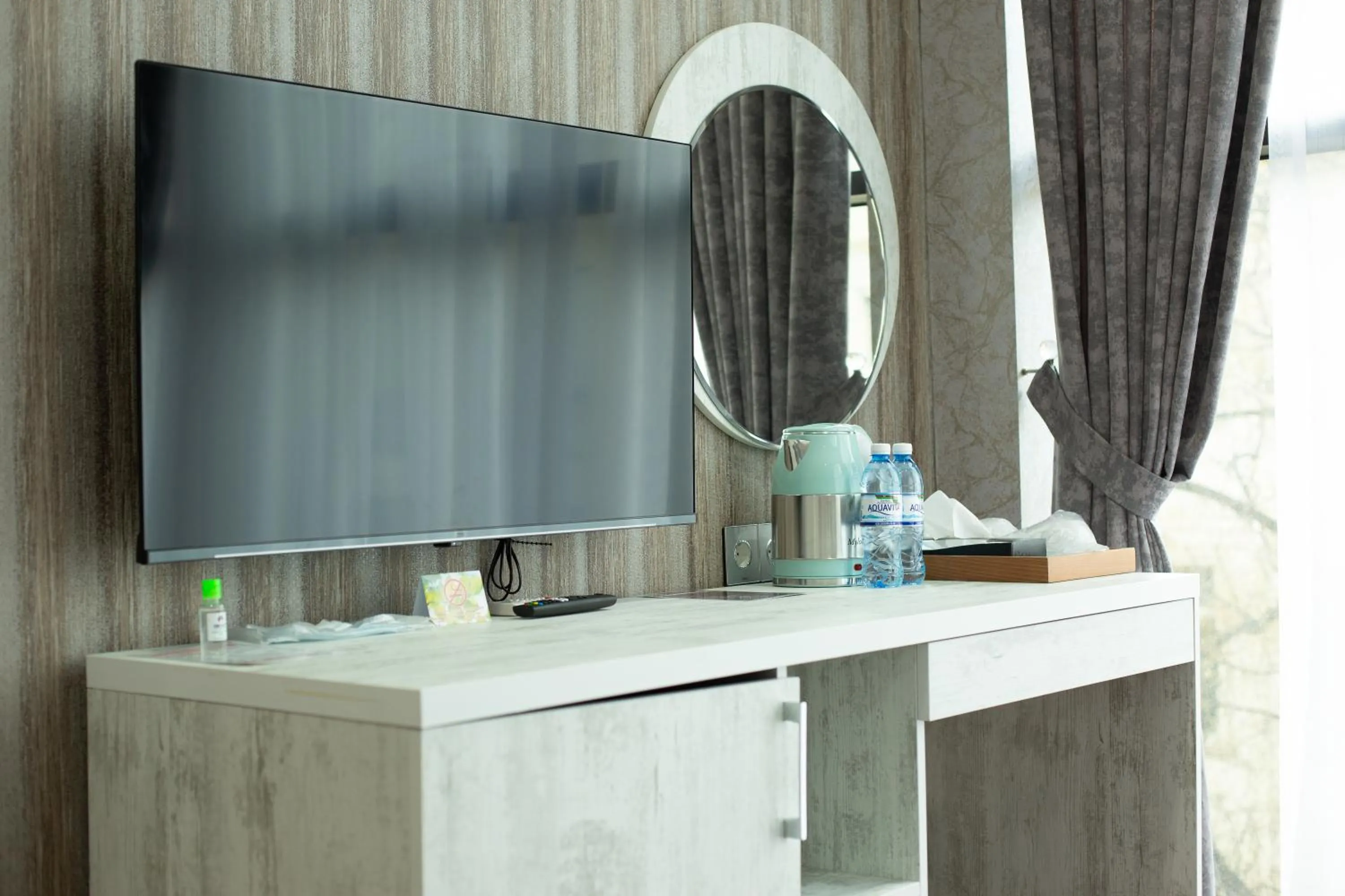 TV and multimedia in Home Suites Baku-Halal Hotel