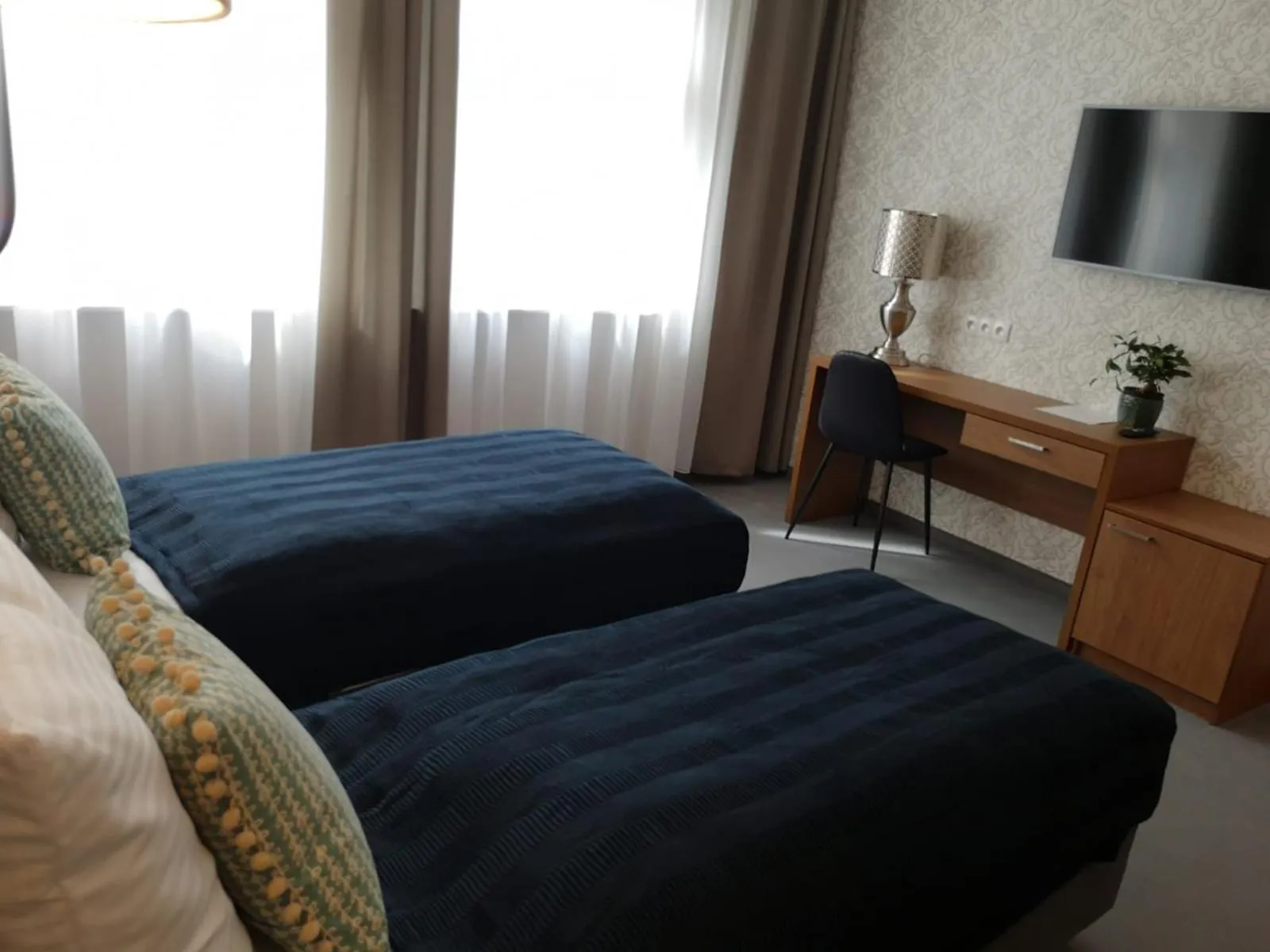 Bed in Brassel Aparthotel