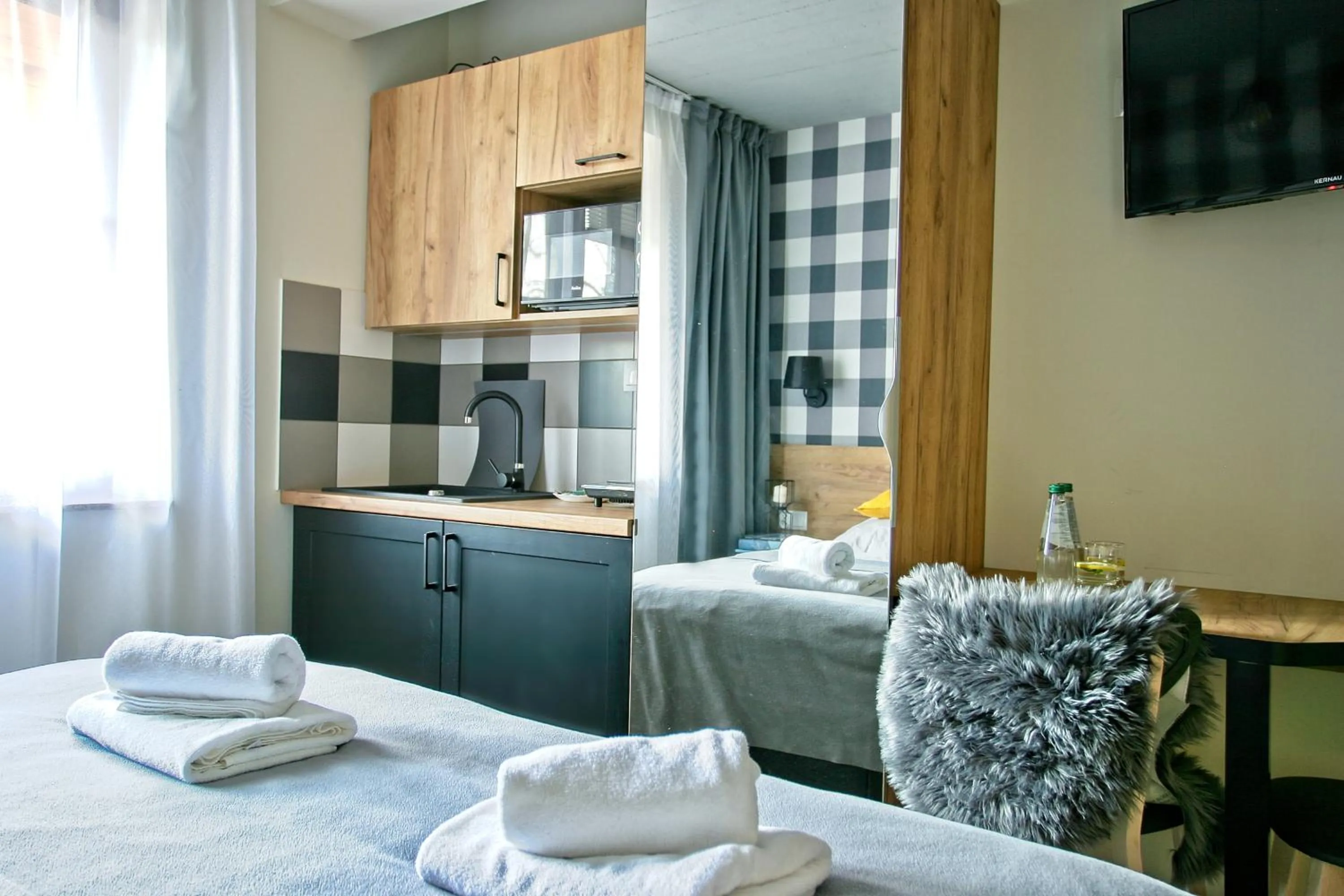 Kitchen or kitchenette, Bed in Apartamenty Magia Gór