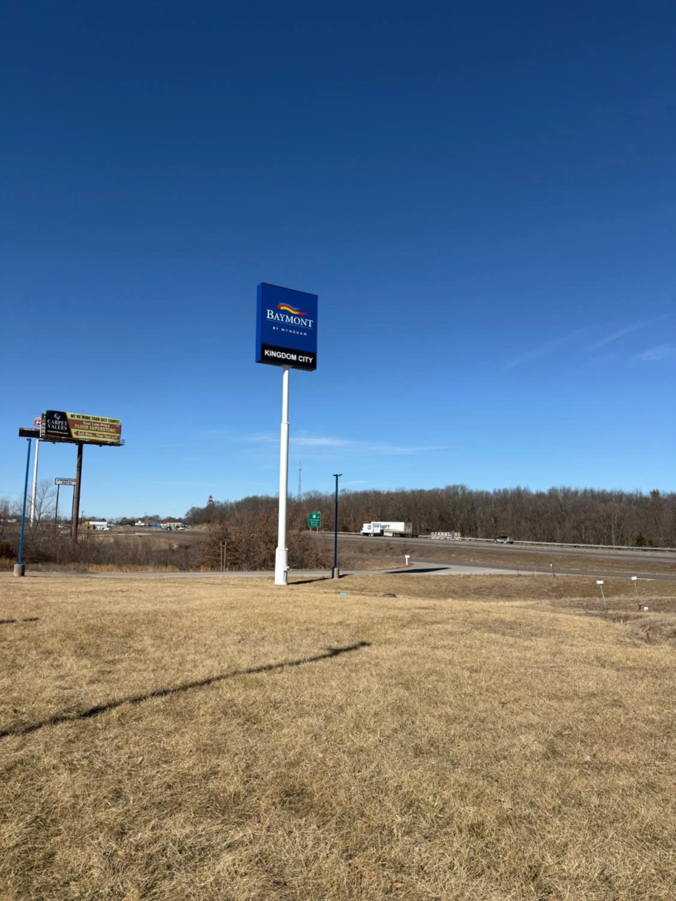 Property logo or sign in Baymont by Wyndham Kingdom City