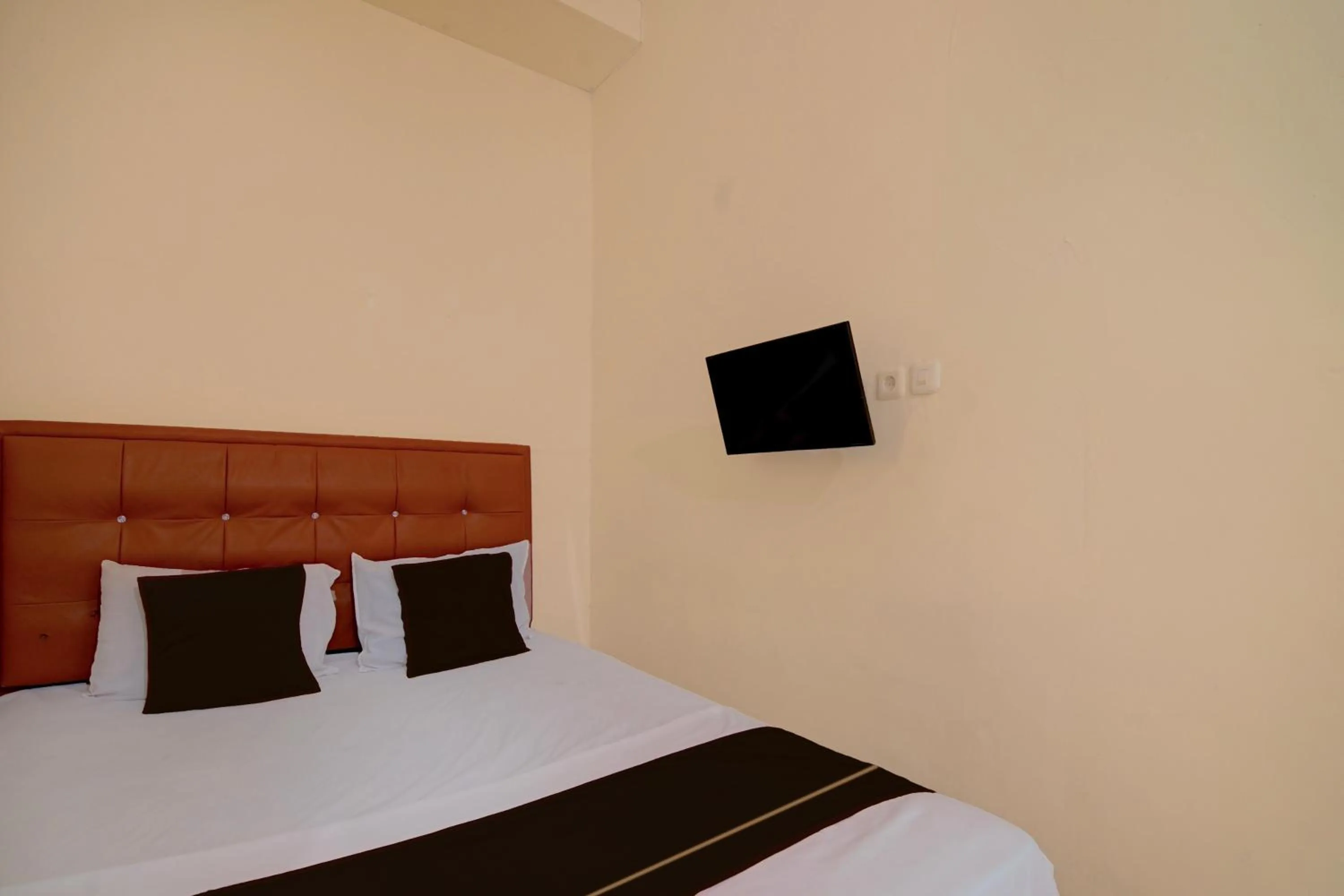 Bedroom, Bed in Hotel O Pekanbaru near Mall Ciputra Seraya formerly Lotus Inn