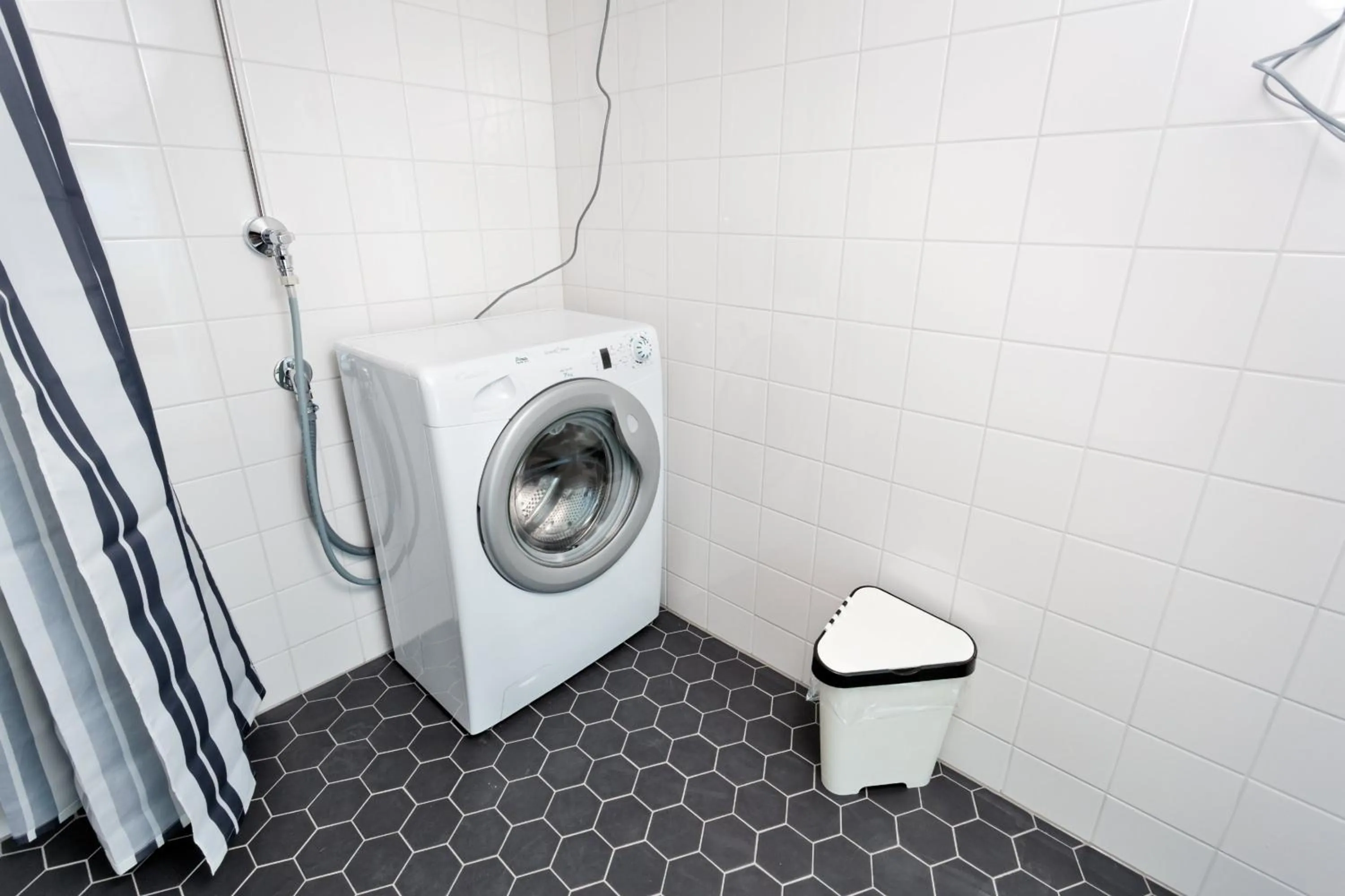 washing machine in Forenom Serviced Apartments Helsinki Kruununhaka