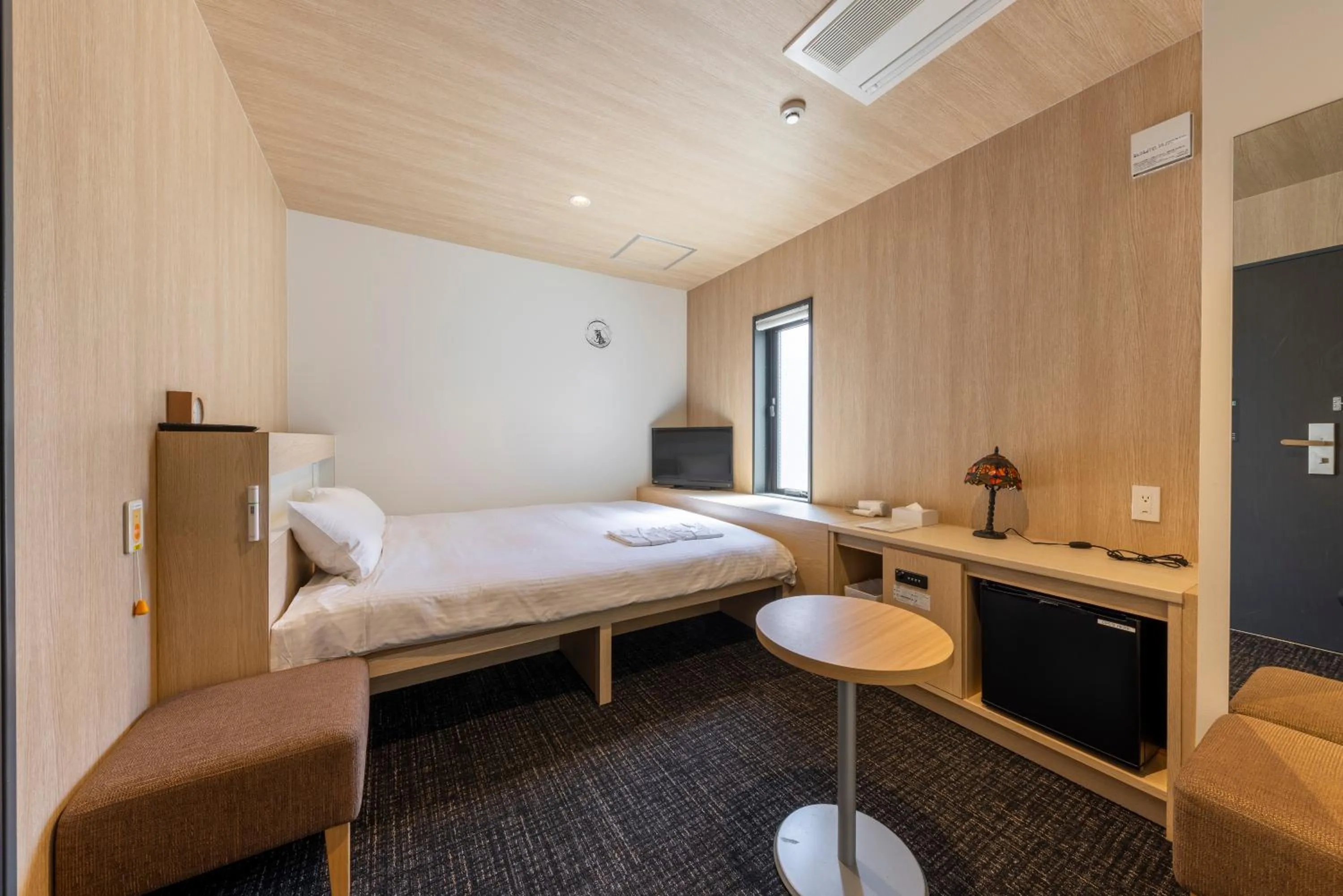 Photo of the whole room, Bed in WeBase Hiroshima