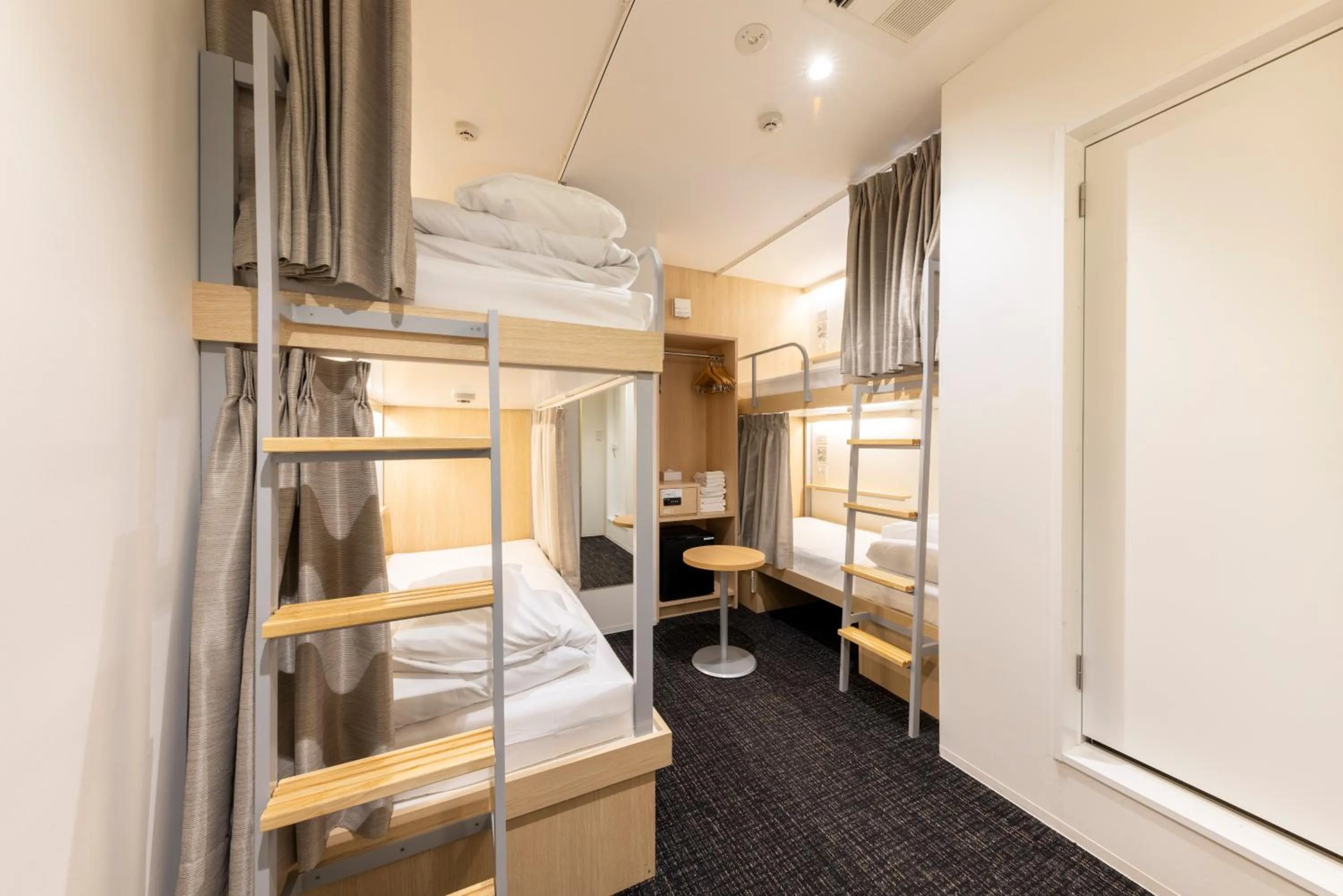 Photo of the whole room, Bed in WeBase Hiroshima