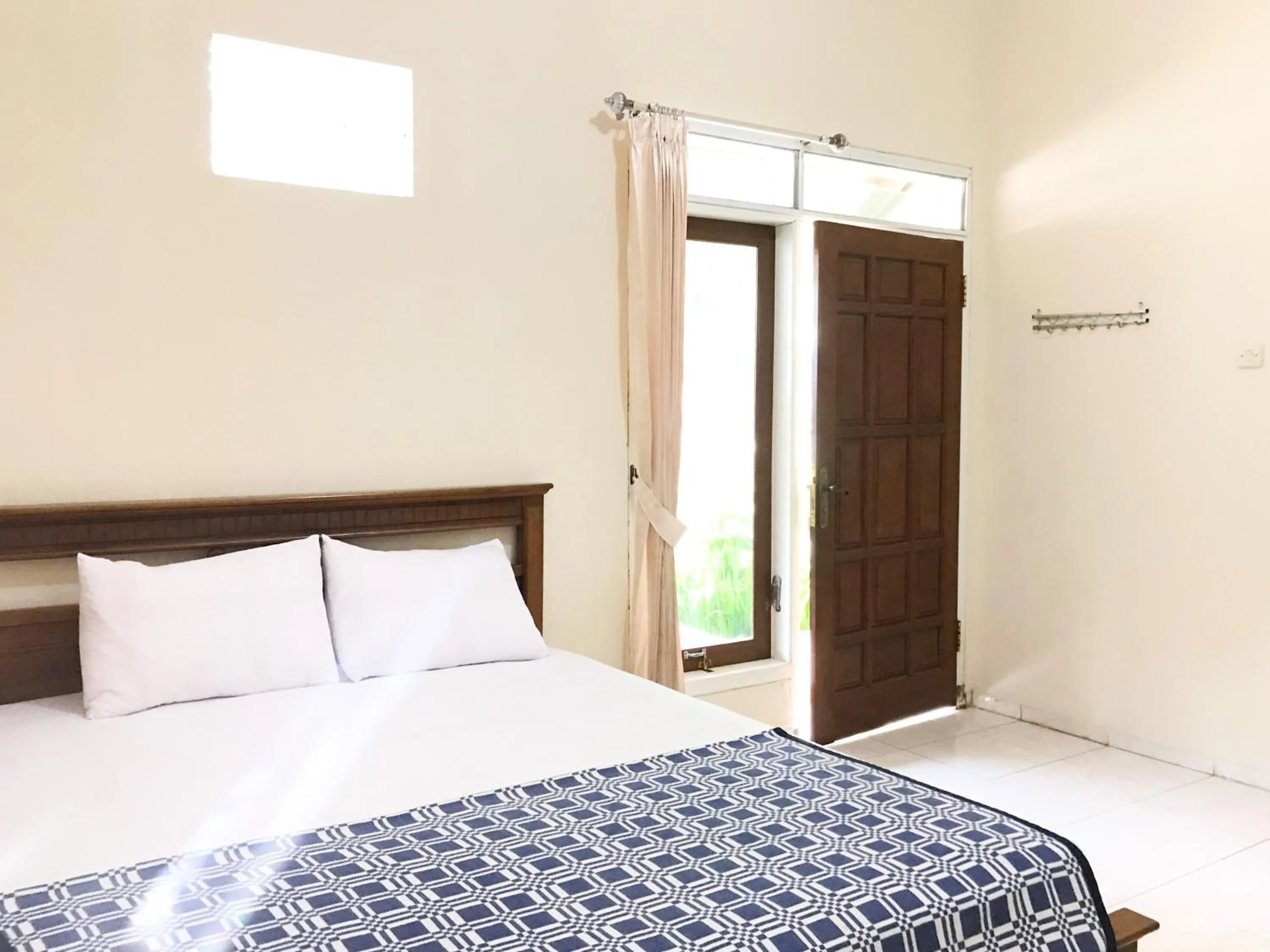 Bedroom, Bed in Villa Bunga Guest House RedPartner