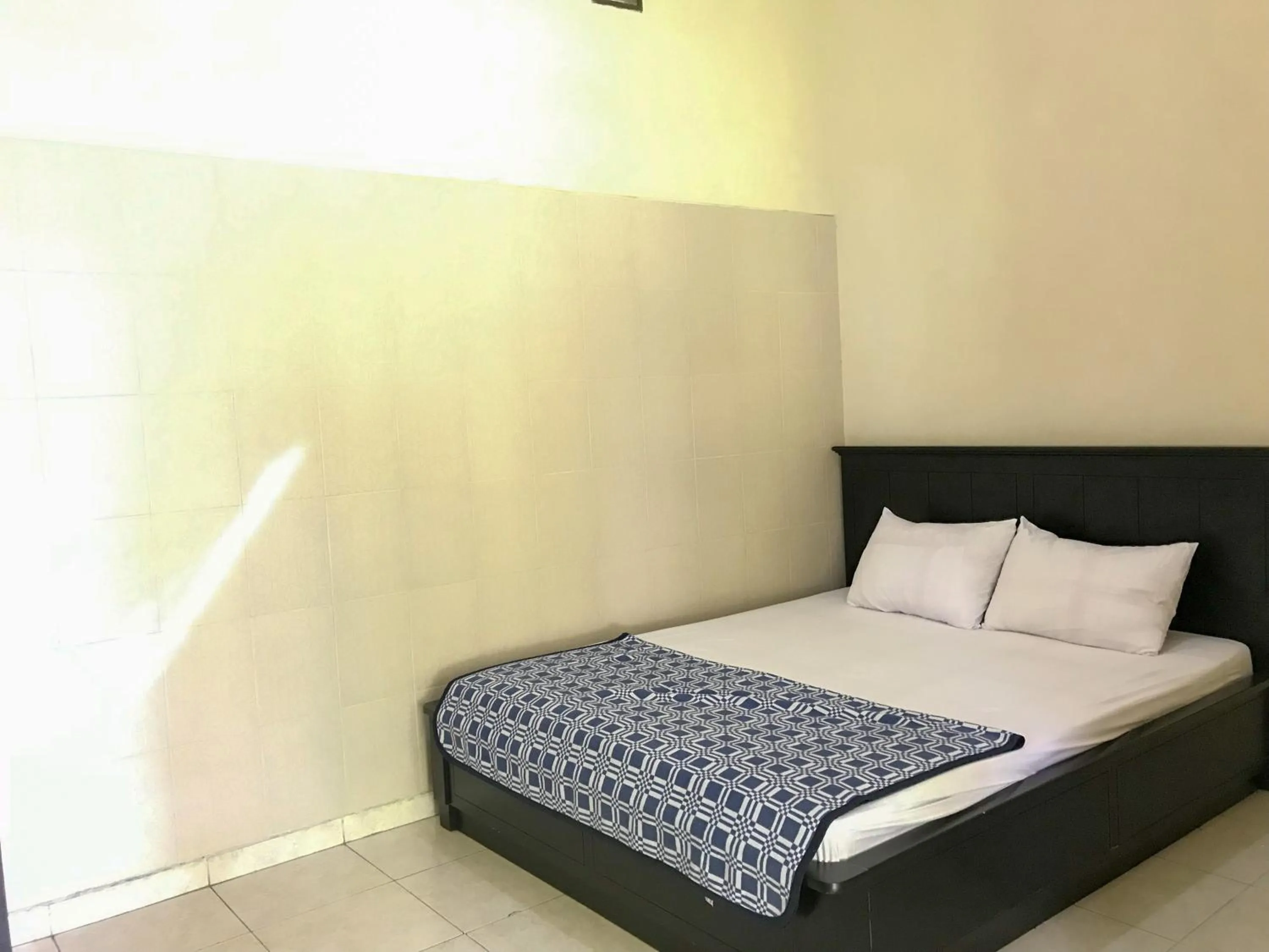 Bedroom, Bed in Villa Bunga Guest House RedPartner