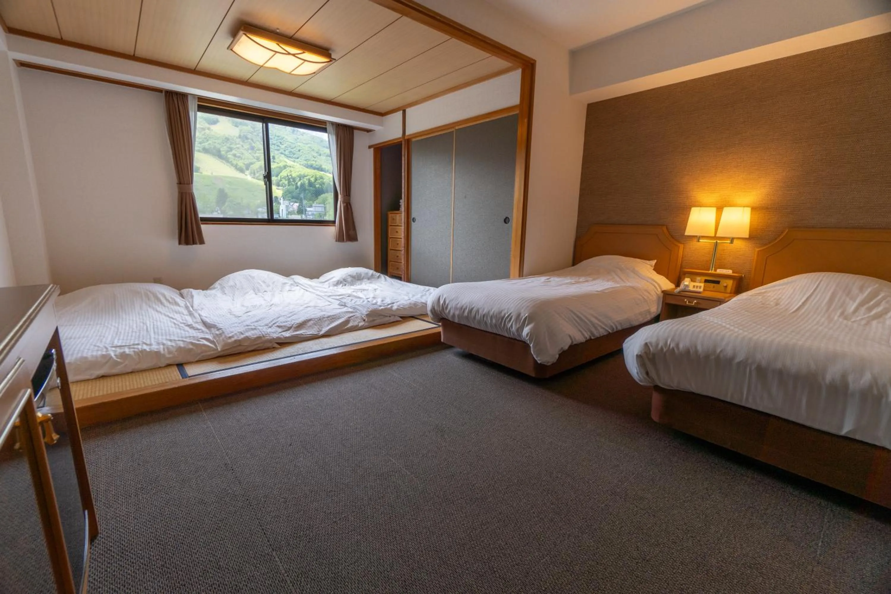 Bed in Hakuba Panorama Hotel