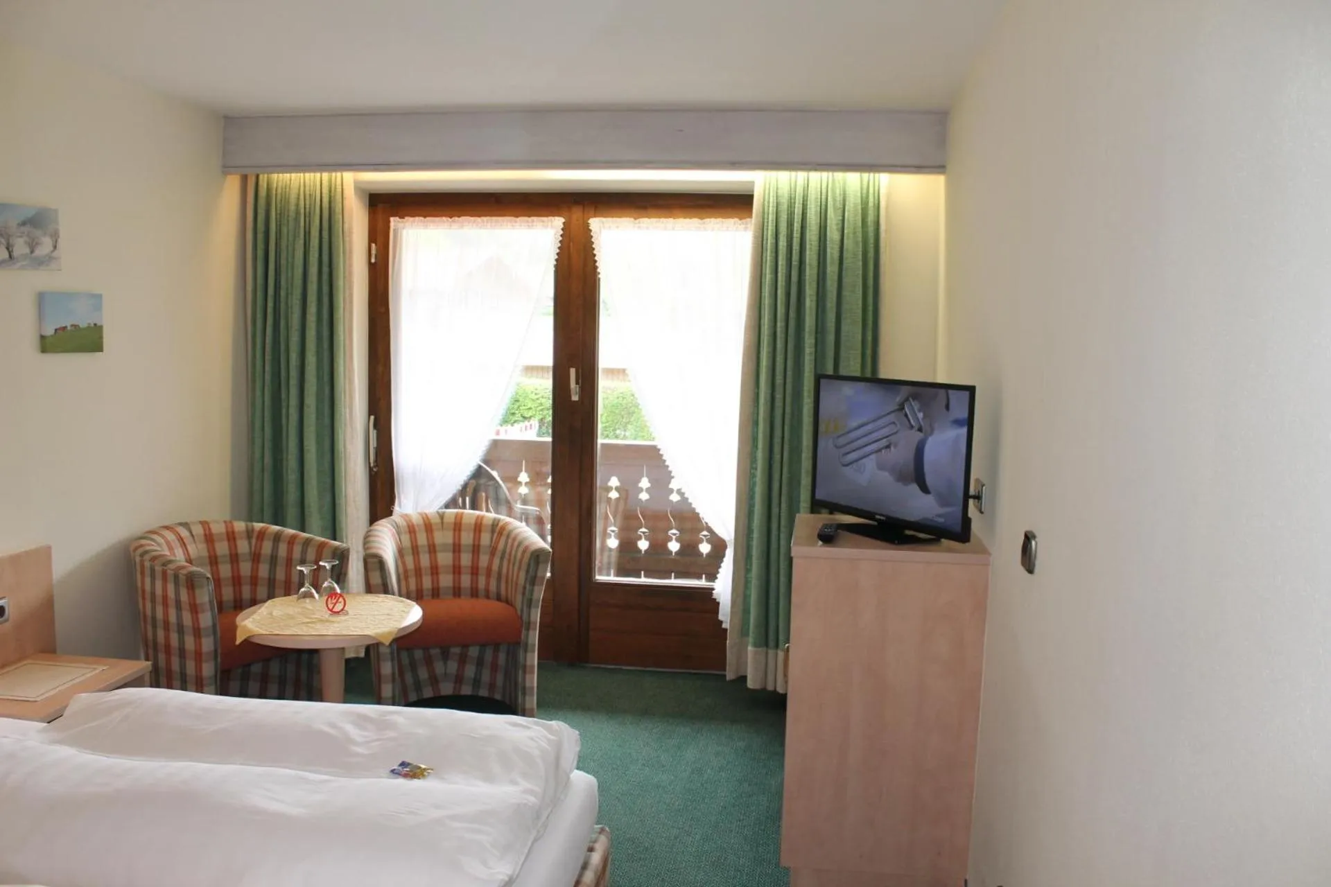 Photo of the whole room, Bed in DEVA Hotel-Restaurant Fischerwirt inklusive Chiemgau Card