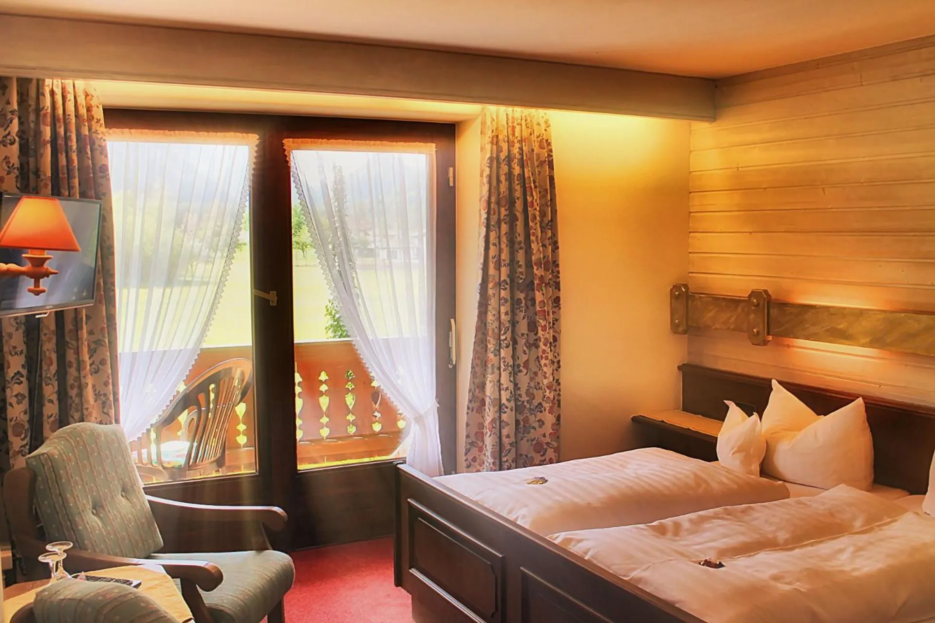 Photo of the whole room, Bed in DEVA Hotel-Restaurant Fischerwirt inklusive Chiemgau Card