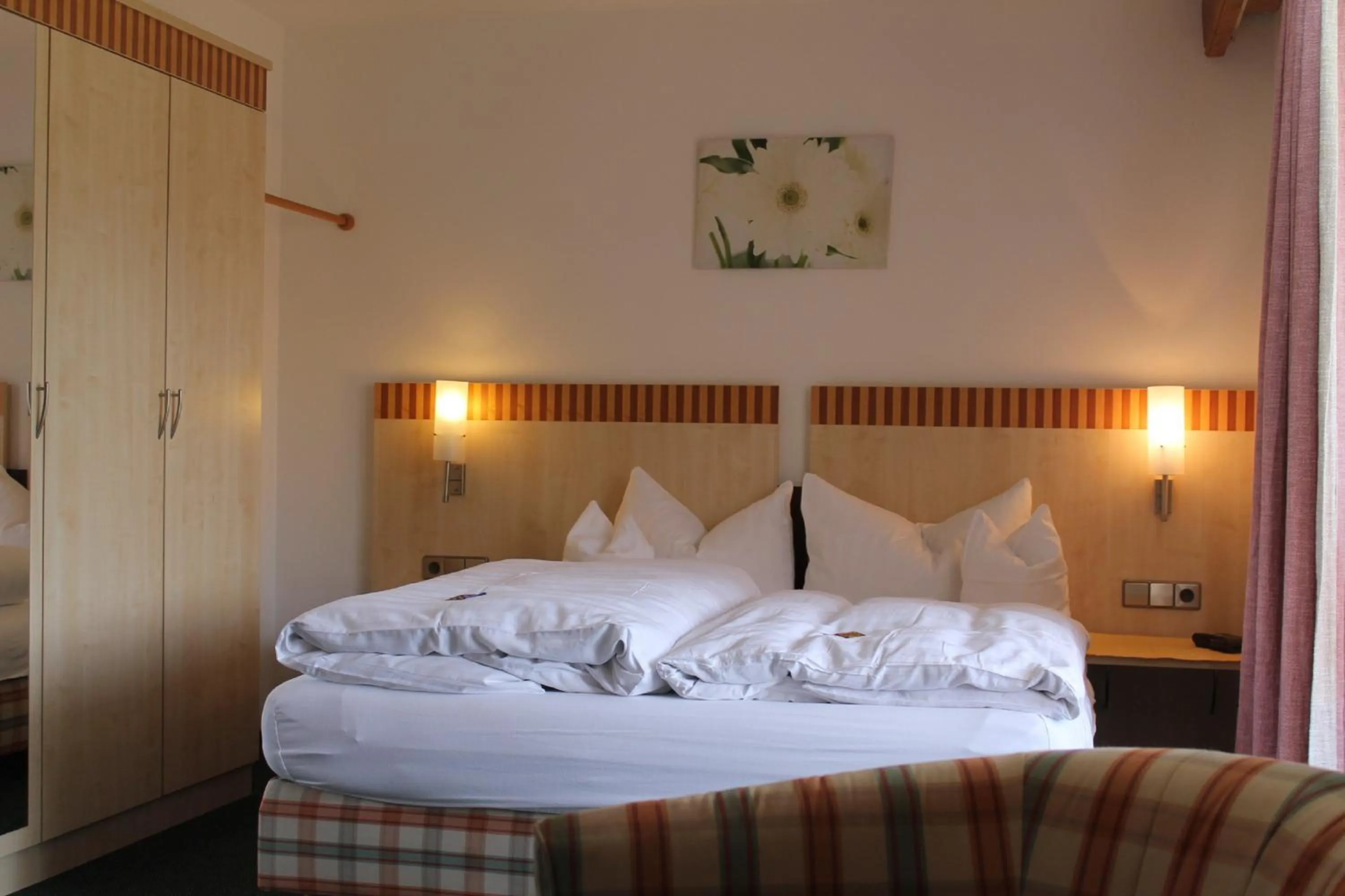 Photo of the whole room, Bed in DEVA Hotel-Restaurant Fischerwirt inklusive Chiemgau Card