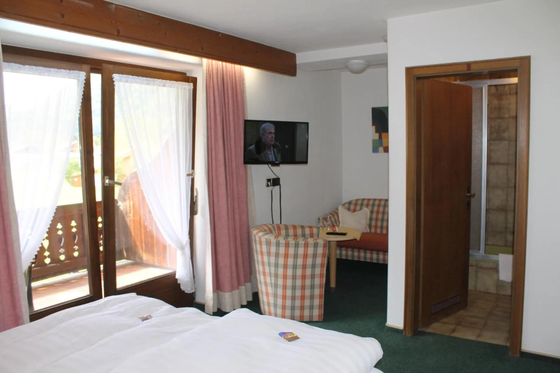 Photo of the whole room, Bed in DEVA Hotel-Restaurant Fischerwirt inklusive Chiemgau Card