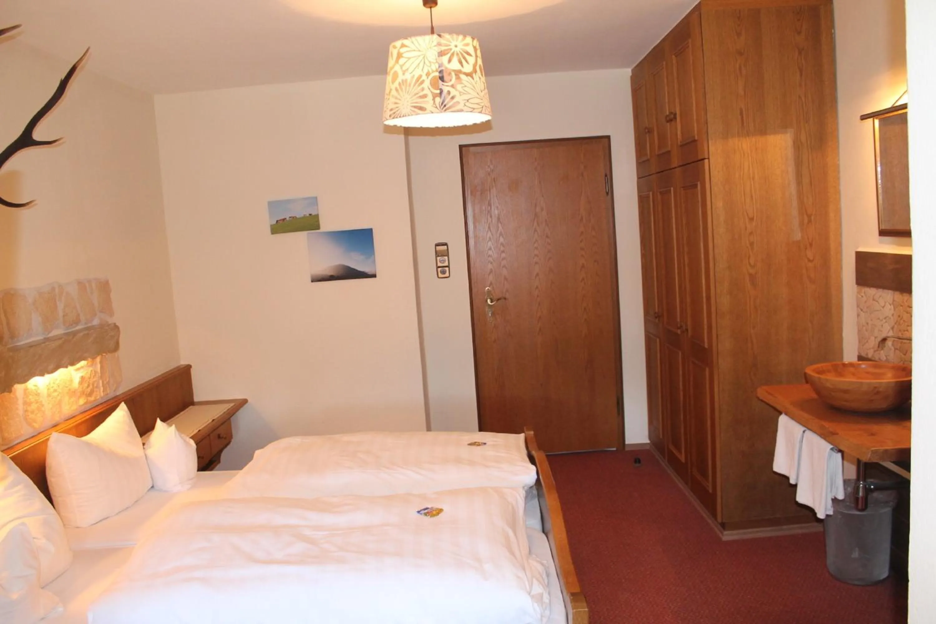 Photo of the whole room, Bed in DEVA Hotel-Restaurant Fischerwirt inklusive Chiemgau Card