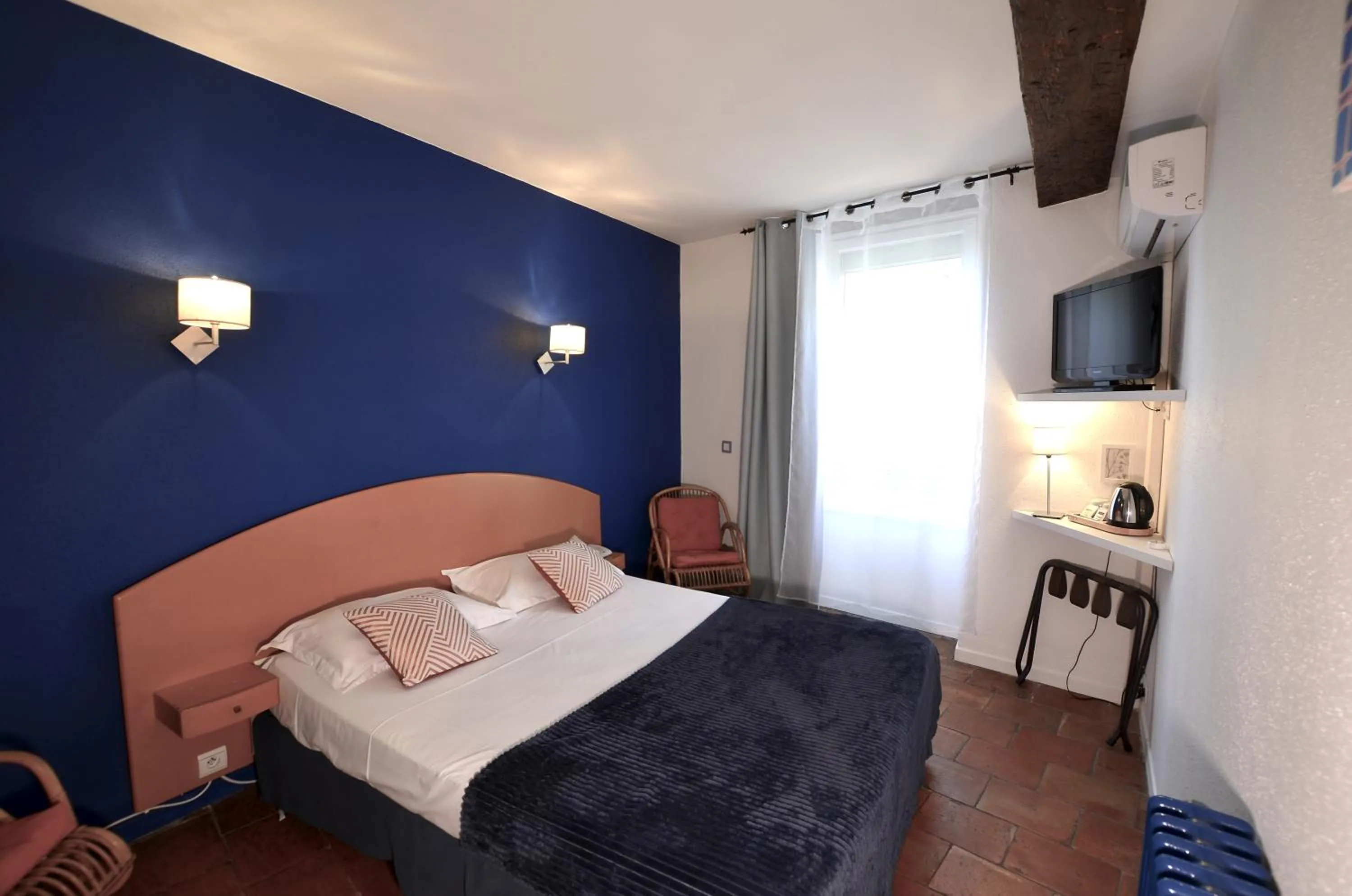 Bedroom, Bed in Logis Hôtels - Hôtel Restaurant du Midi