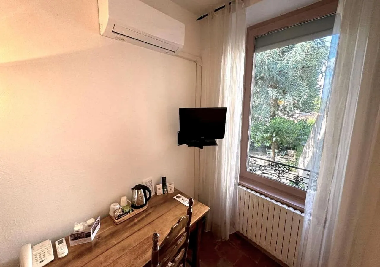 Garden view in Logis Hôtels - Hôtel Restaurant du Midi