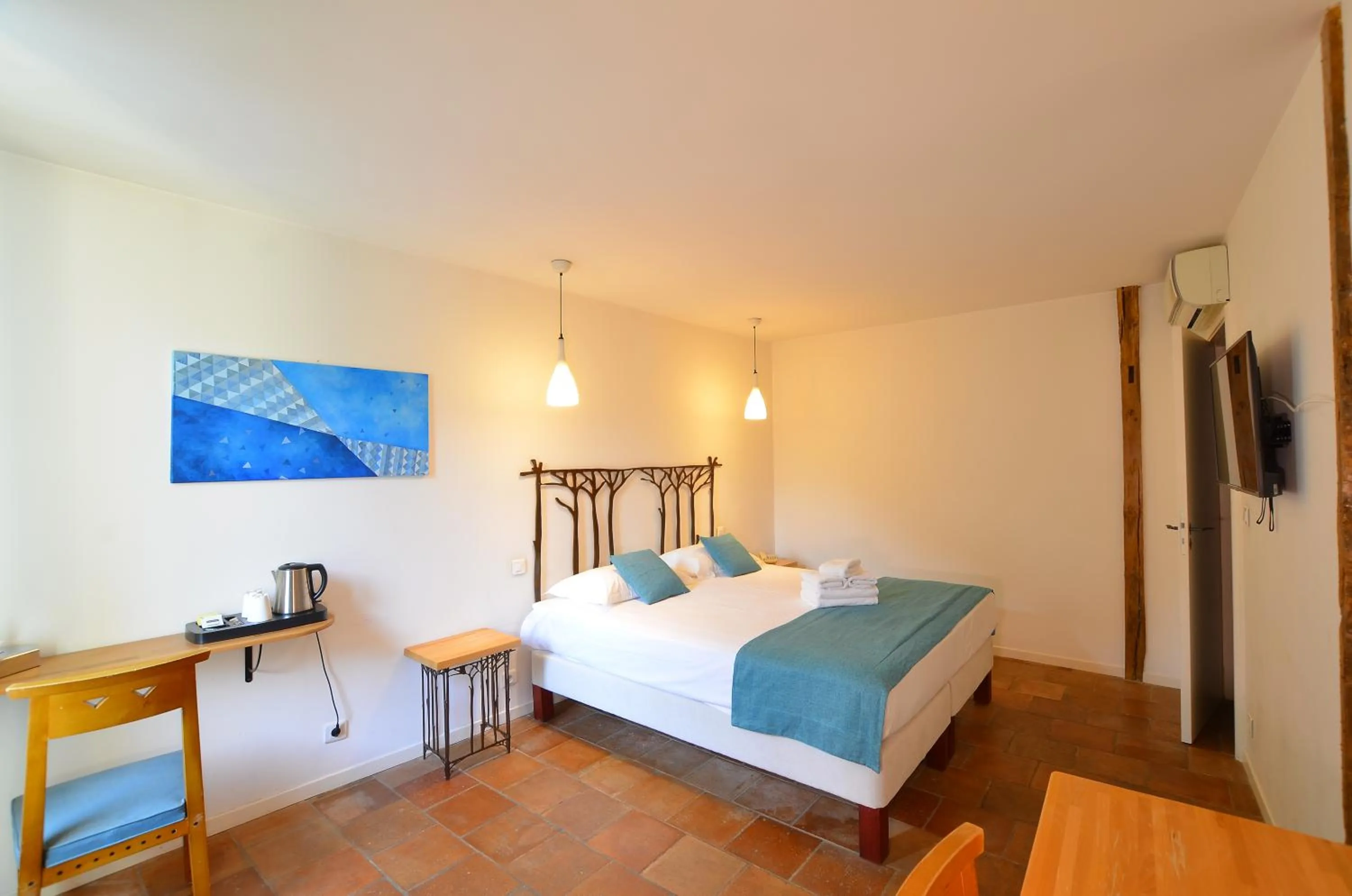 Bedroom, Bed in Logis Hôtels - Hôtel Restaurant du Midi