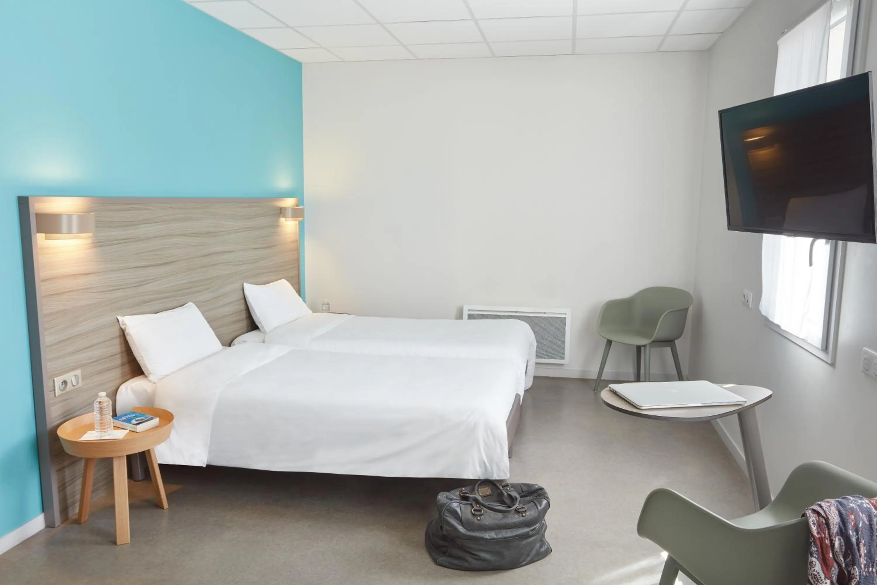 Bed in Ashley Hotel Le Mans Sud