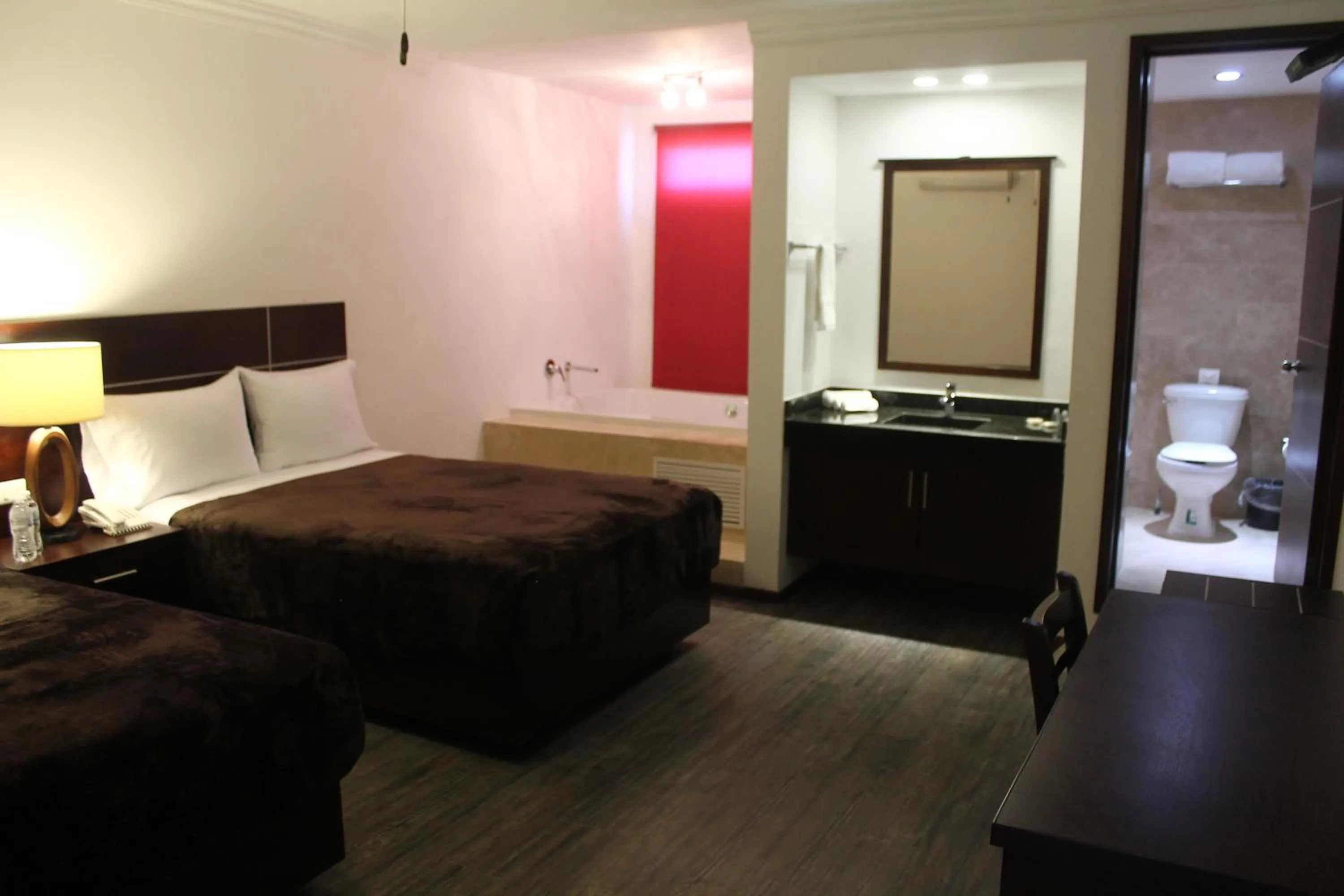 Bed in Hotel Rincon Real Suites