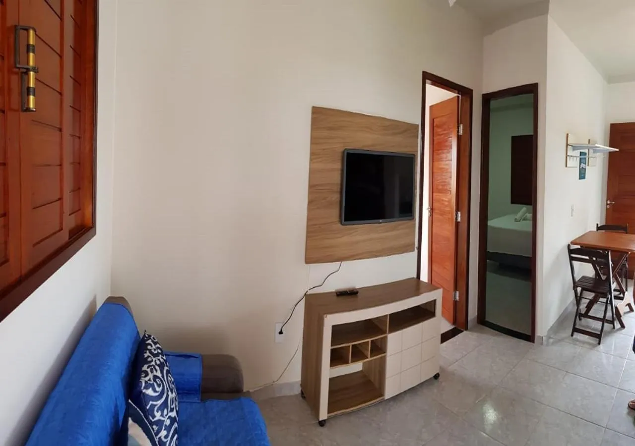 Communal lounge/ TV room in Flat's Portal do Sol-SMG