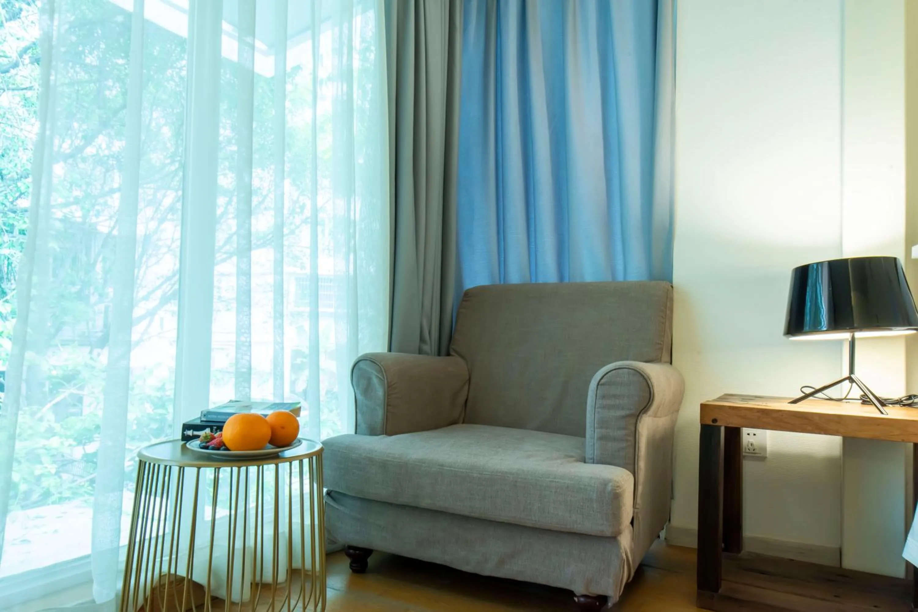 Seating area in 6號花園別墅酒店 Shenzhen No'6 Garden Villa --French Window with garden view,Close to Sea World &Shekou Ferry Port &K11 Ecoast &Subway Nearby ,Offer Western food and coffee &English speaking with tour services