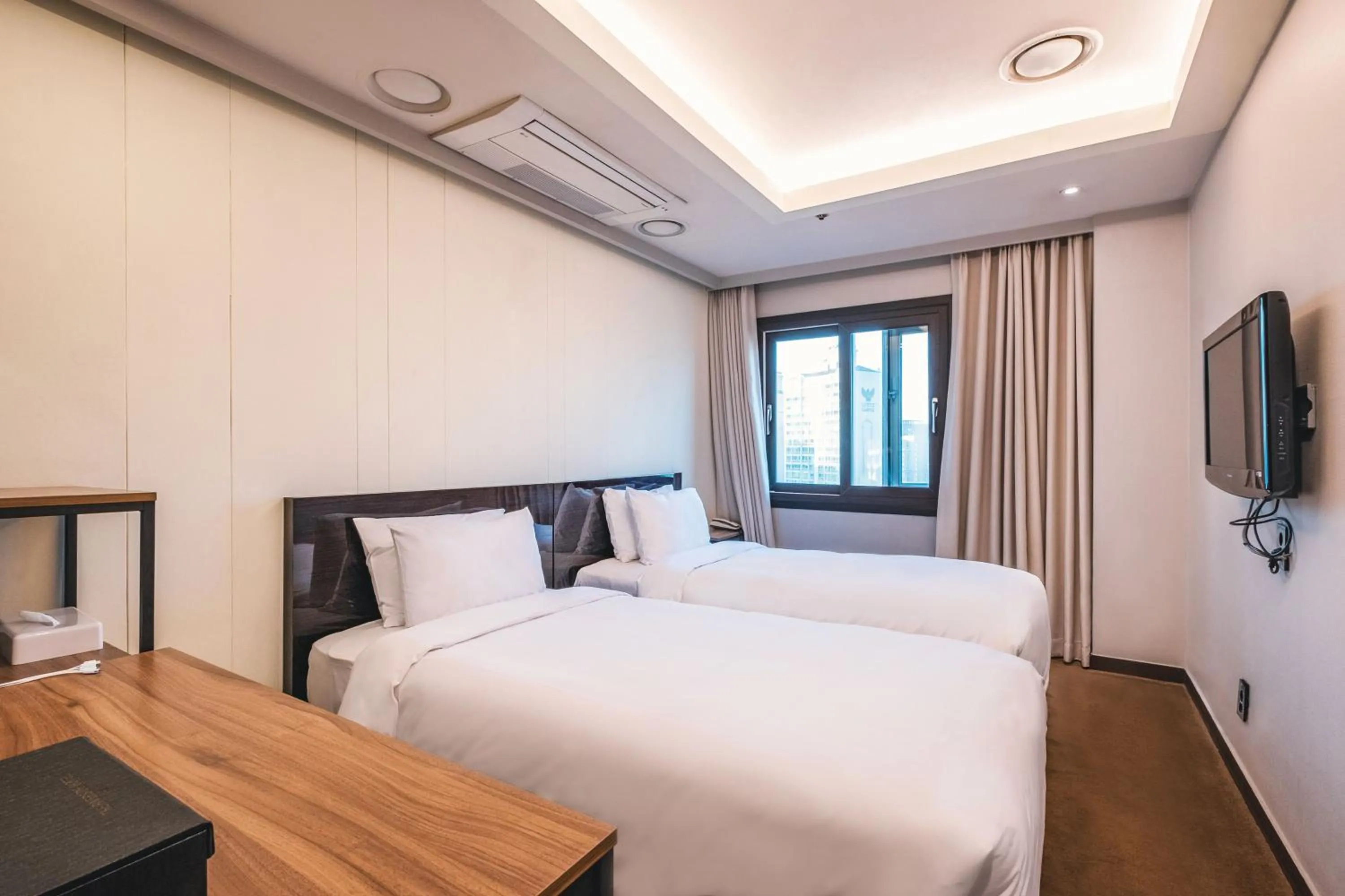 Bed in The Riverside Hotel