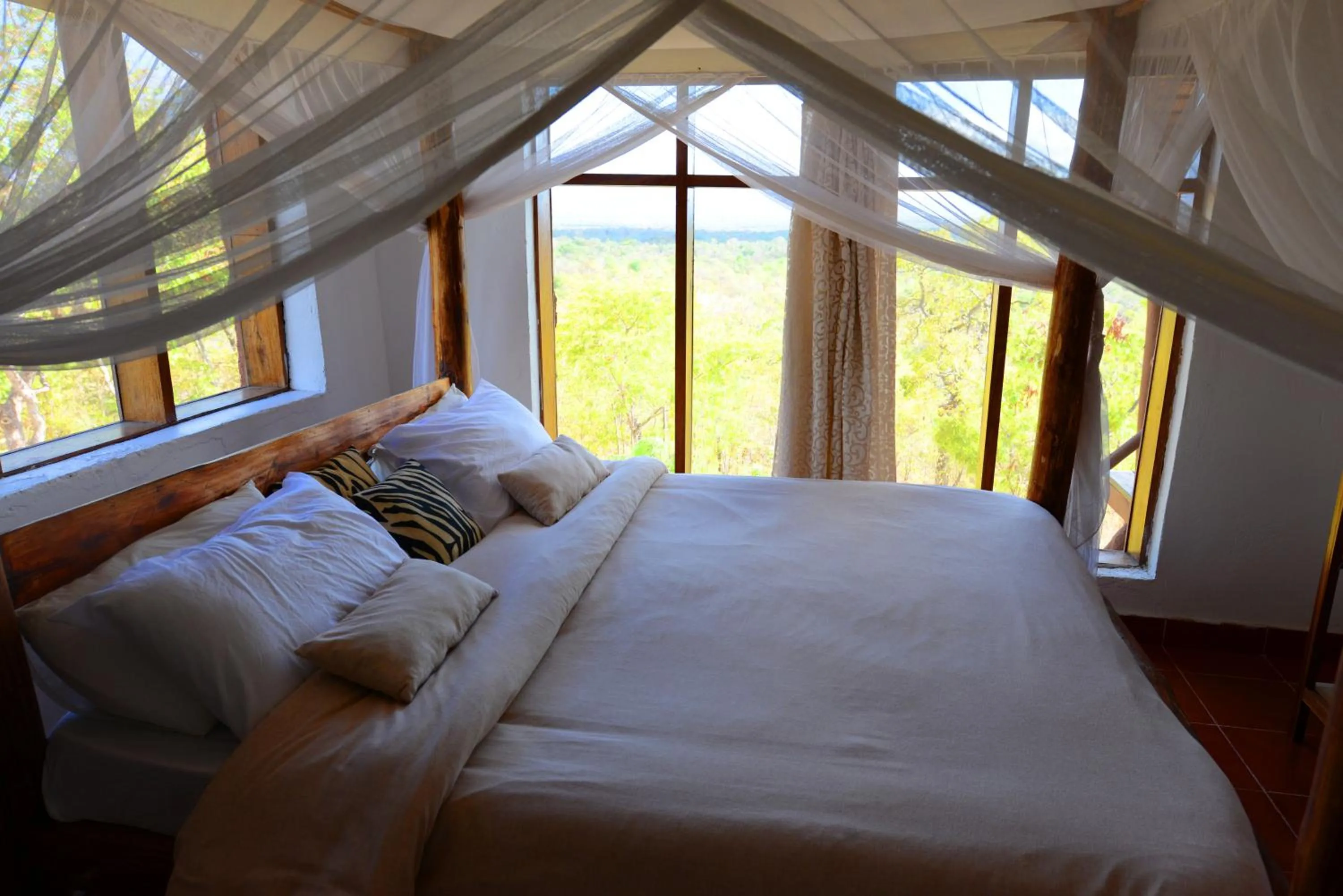 View (from property/room), Bed in Sable Mountain Lodge, A Tent with a View Safaris