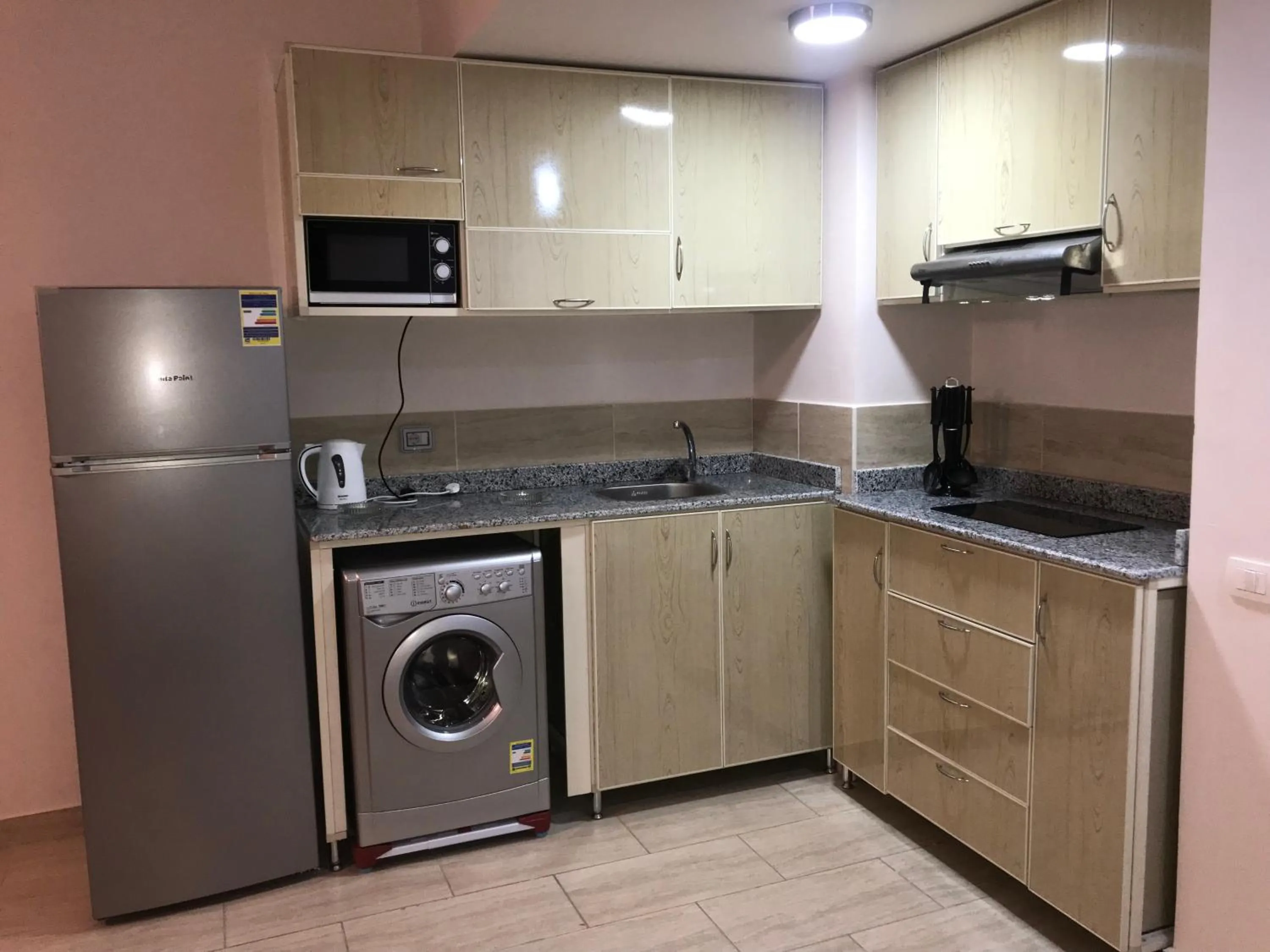Communal kitchen in AlDau Heights Apartments