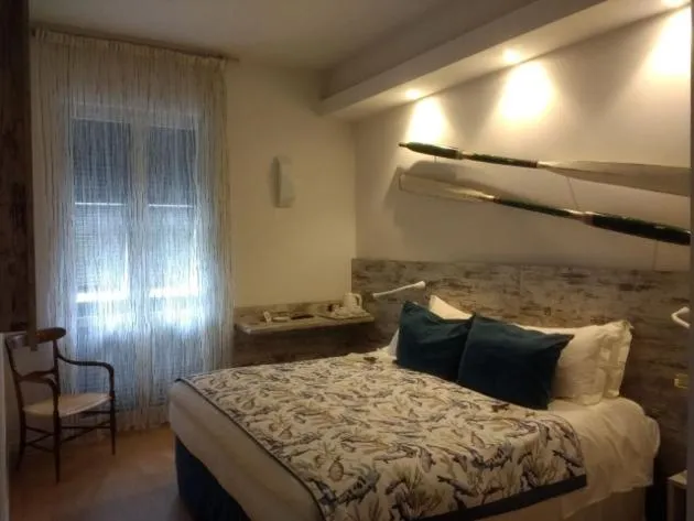 Bed in Piccolo Hotel