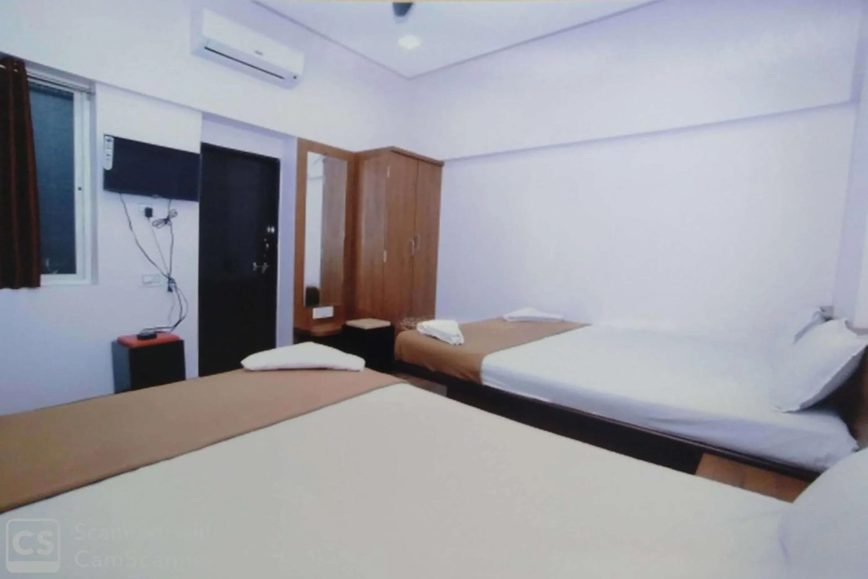 Bed in Rajhuns Deluxe Lodging