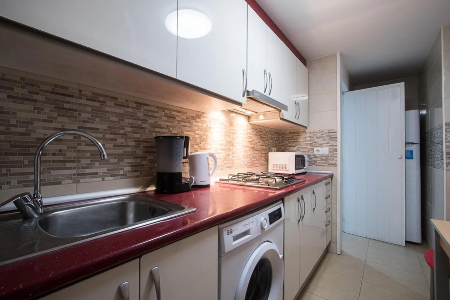 Kitchen or kitchenette in Apartamentos Torre Yago