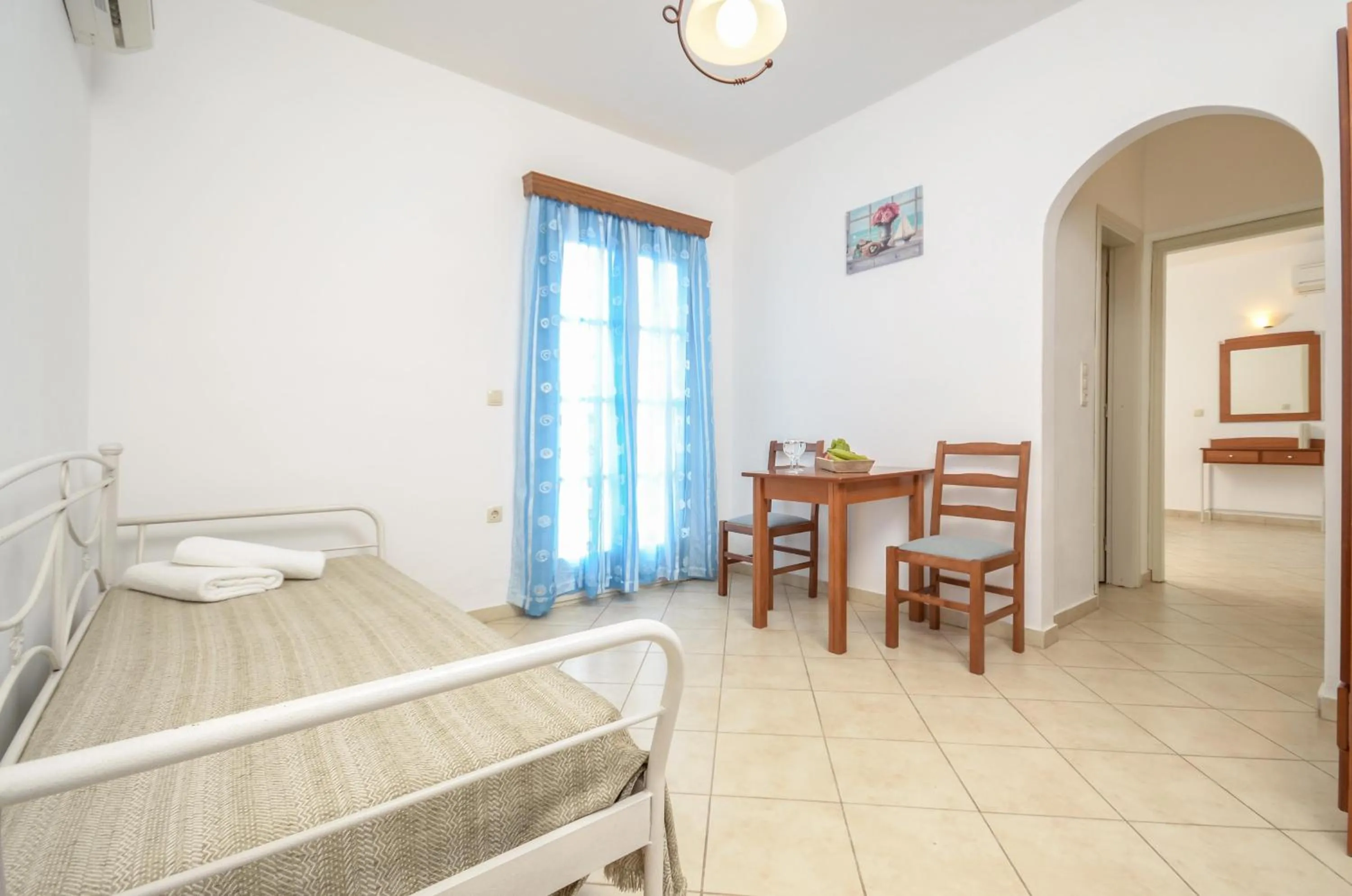 Seating area, Bed in Asterias Studios