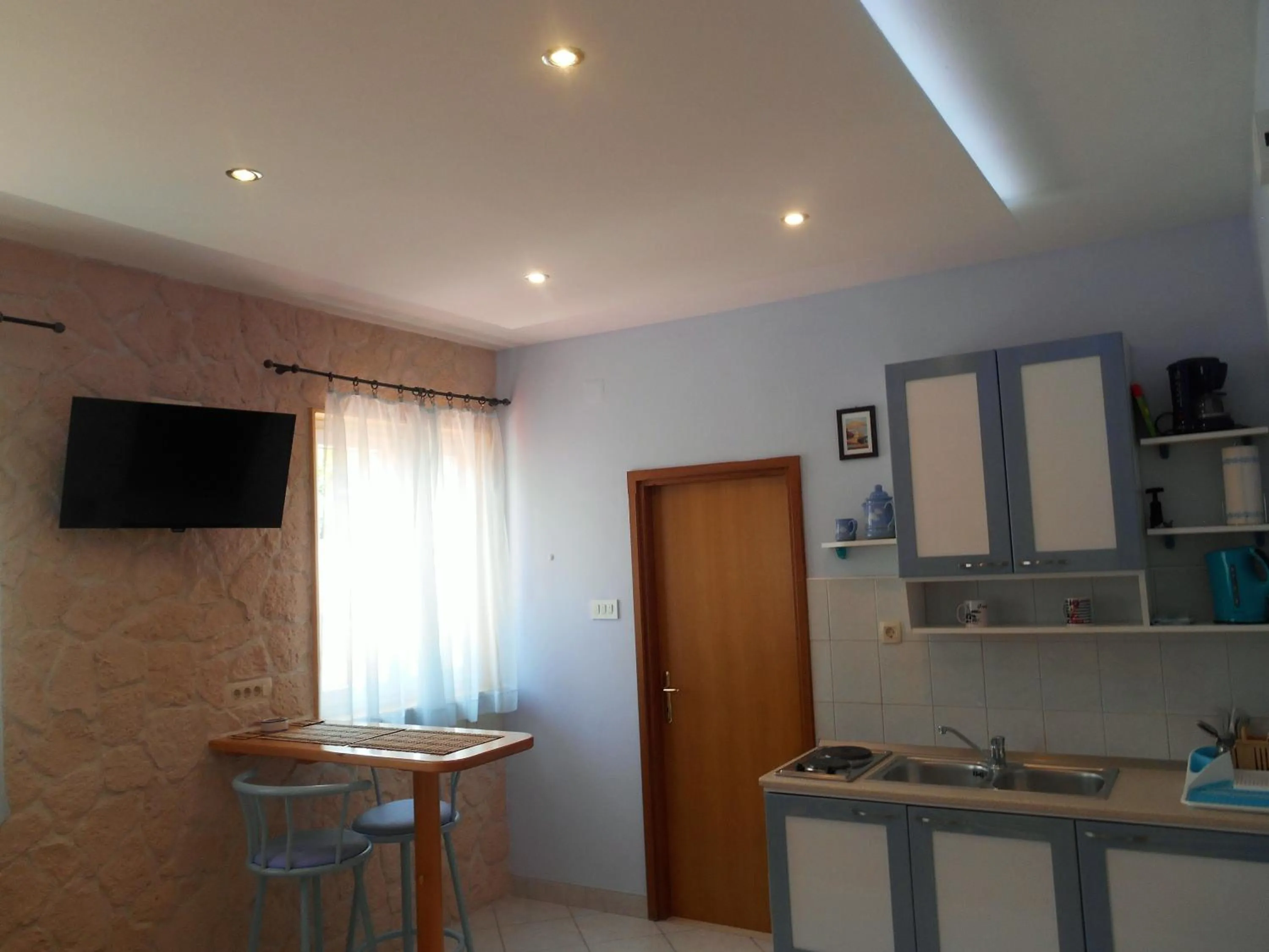 Kitchen or kitchenette in Apartments Brešan