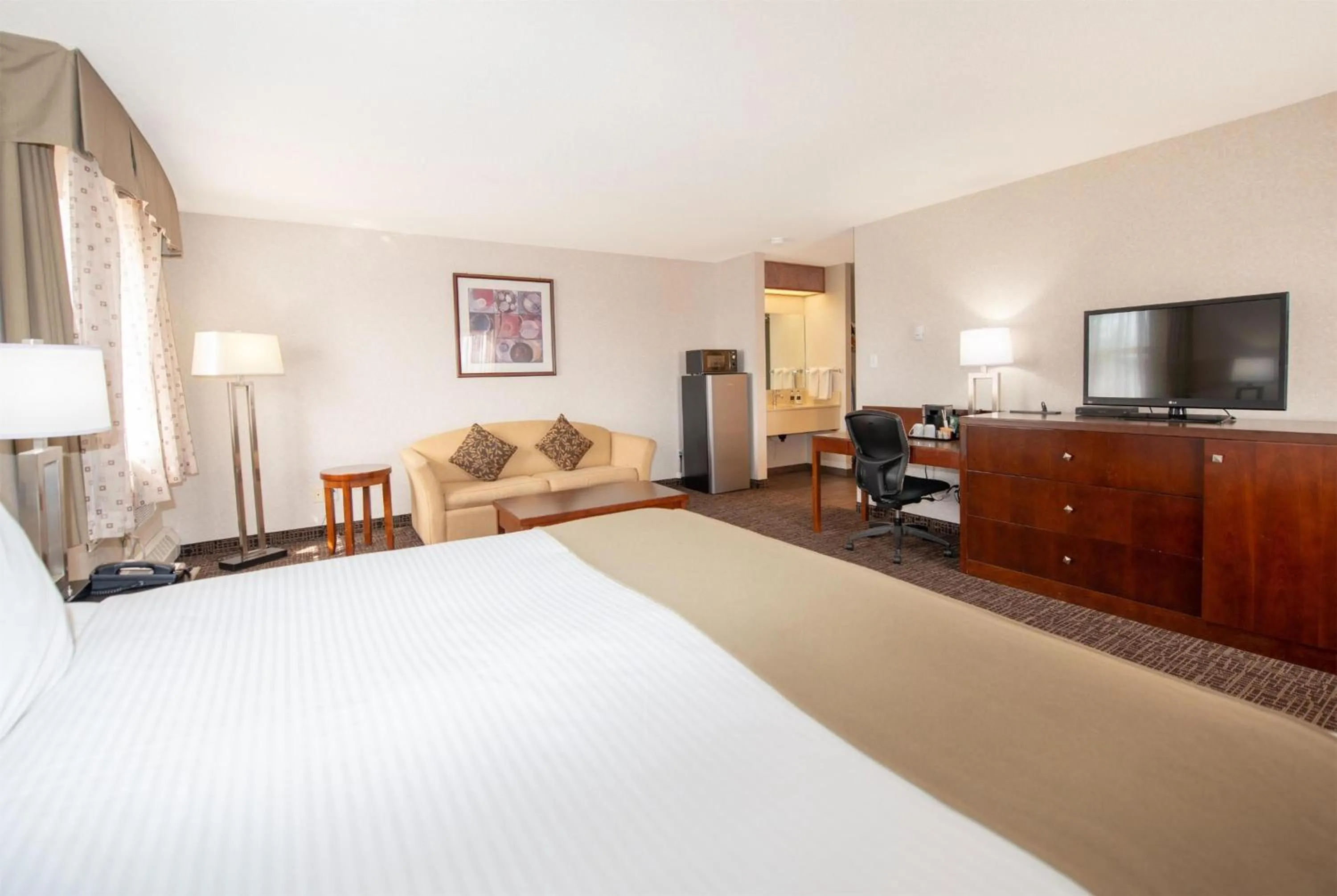 Photo of the whole room, Bed in Coast Fort St John Hotel