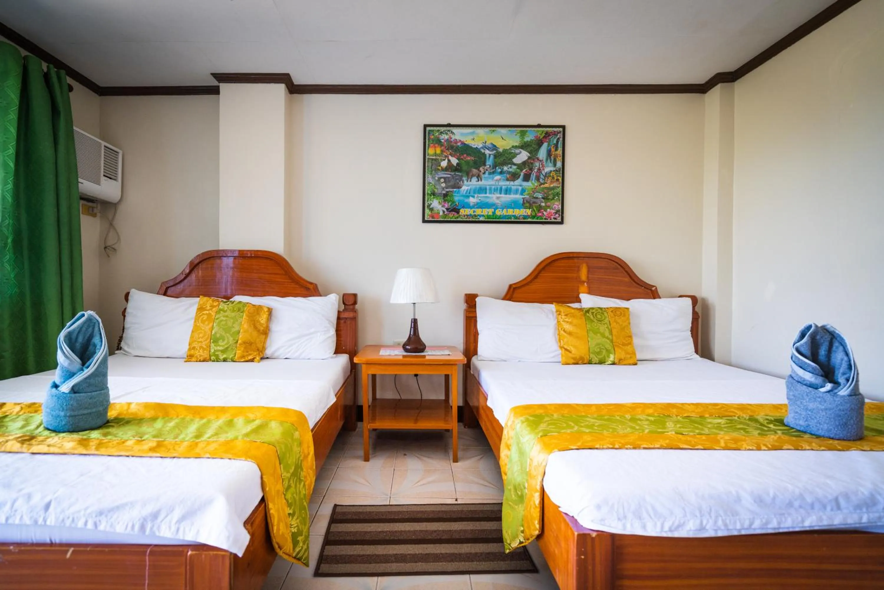 Bed in Blue Corals Beach Resort