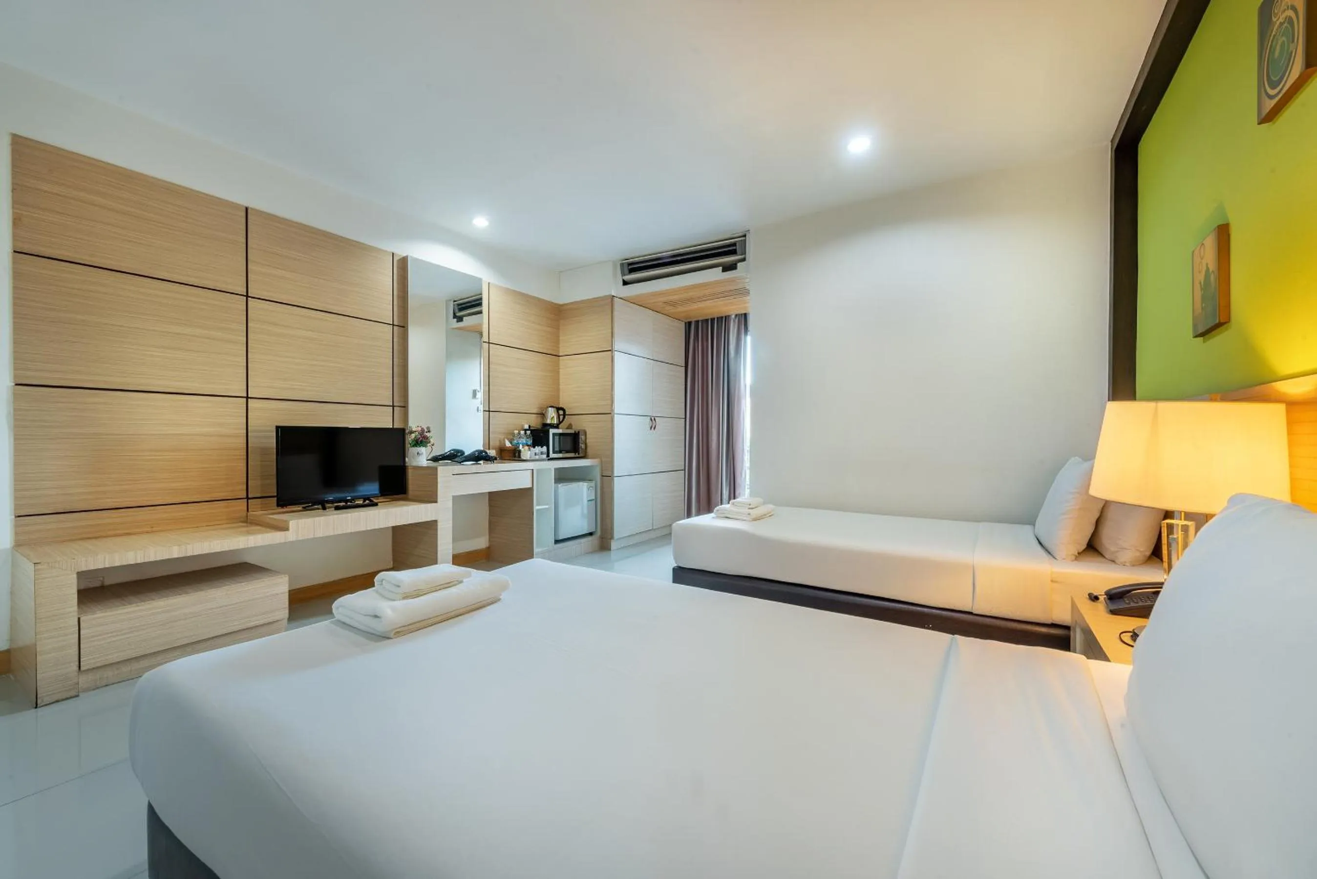 Bed in The Legacy Convention Hotel