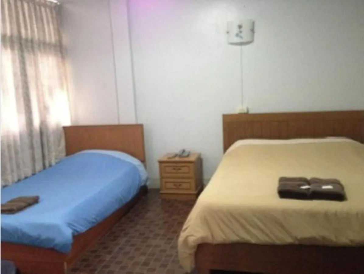 Bed in White Orchid Inn I