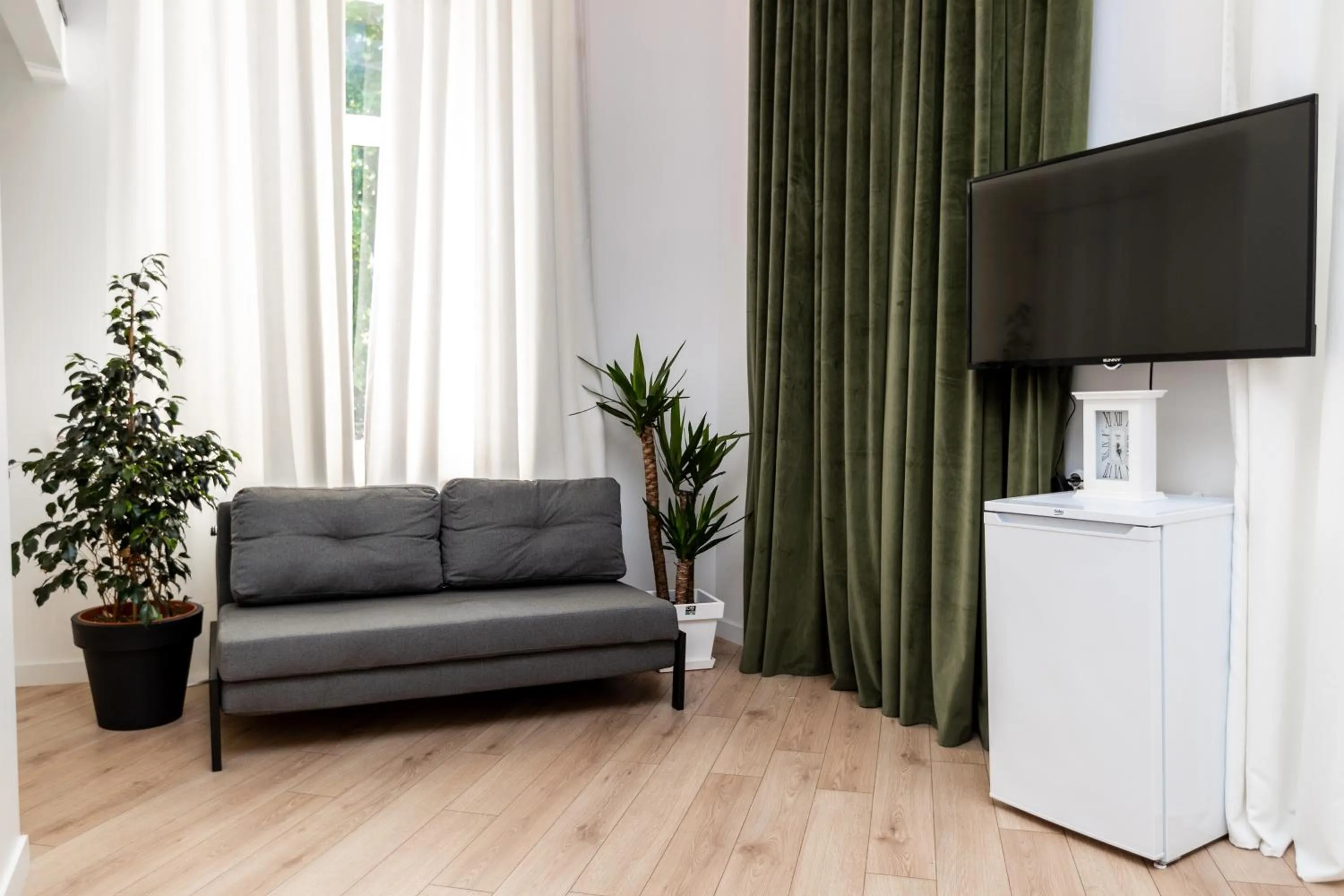 Communal lounge/ TV room in Shota Rustaveli Aparthotel