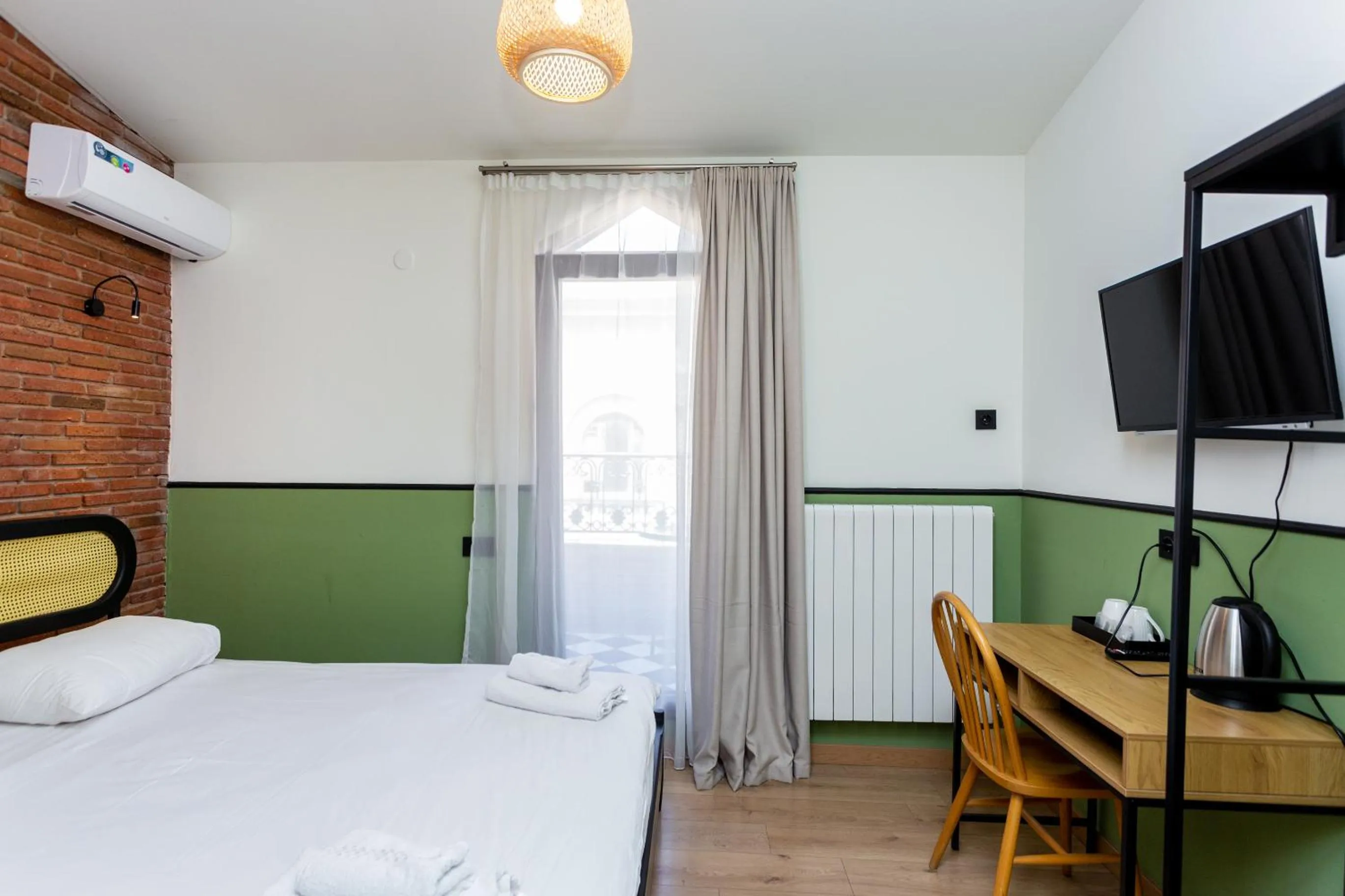 Bed in Shota Rustaveli Aparthotel