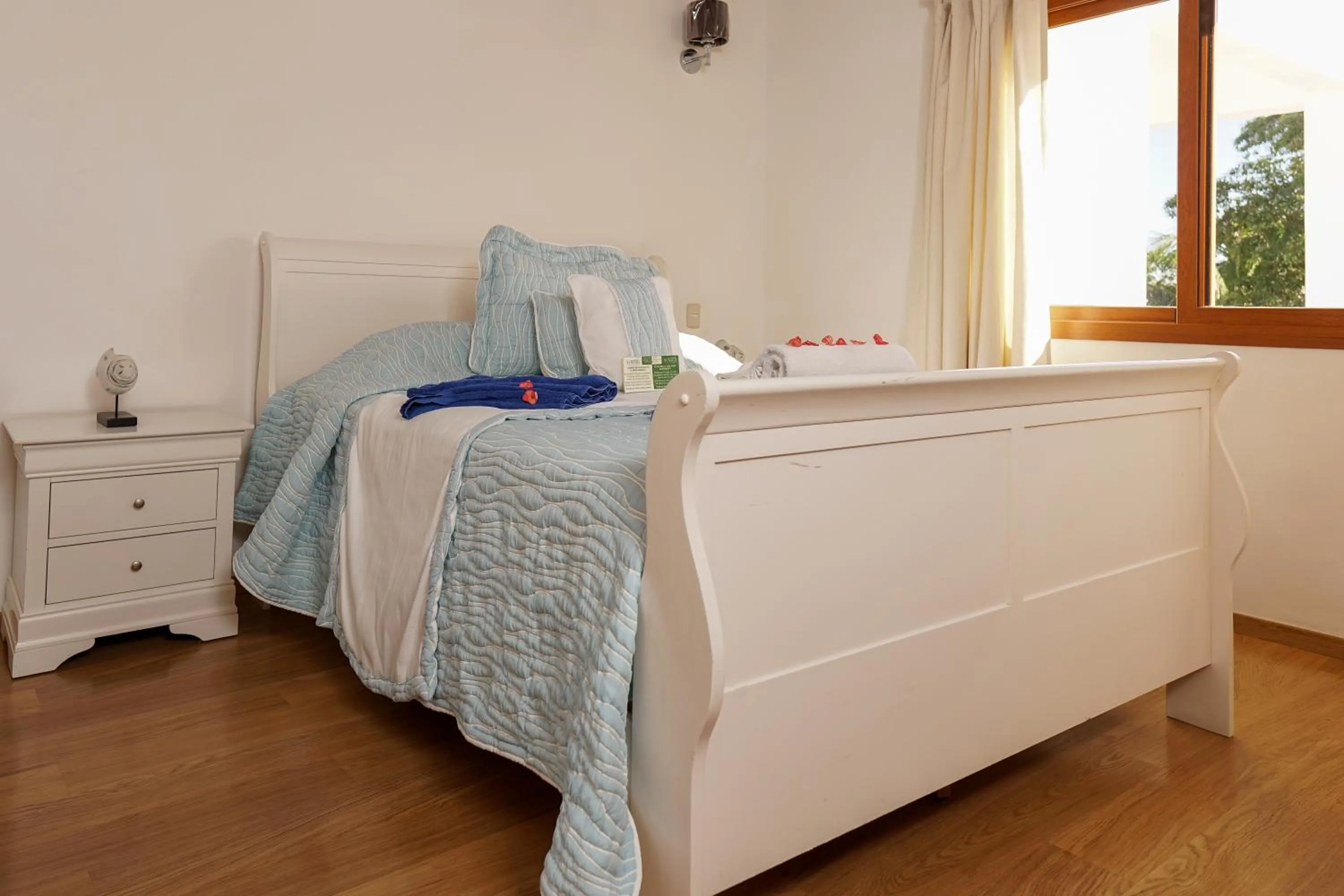 Bed in Sybaris Suites & Residences