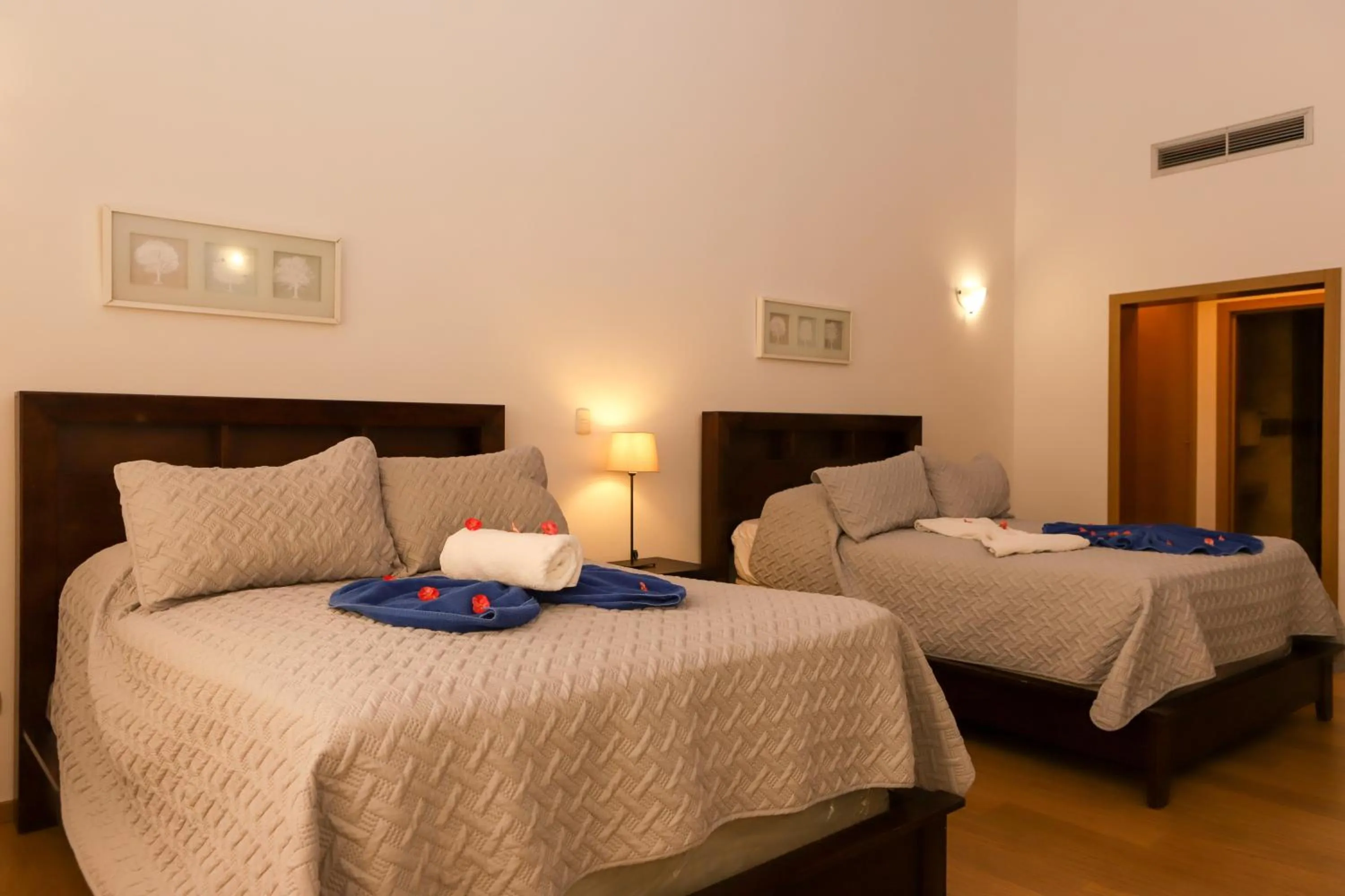 Bed in Sybaris Suites & Residences