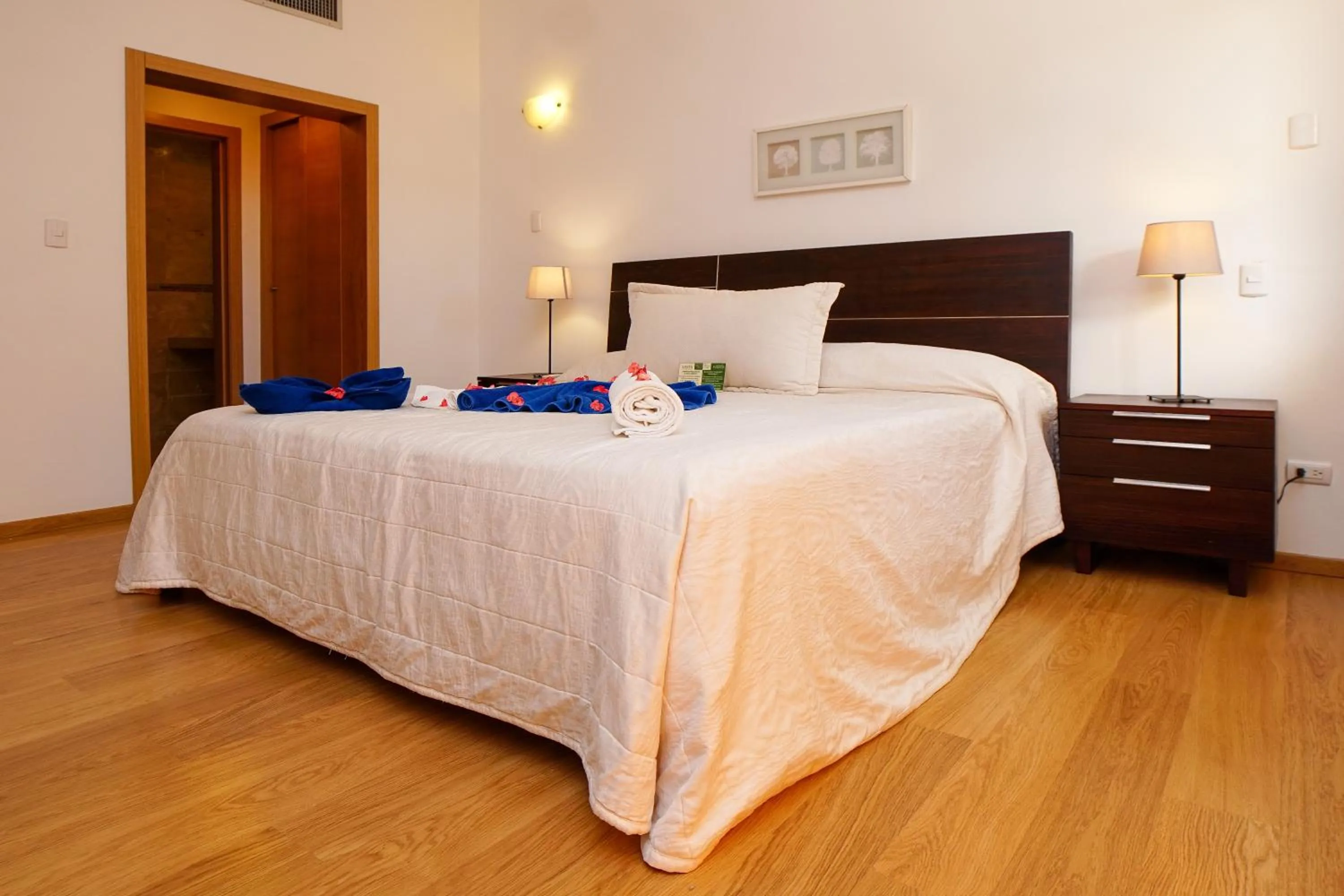 Bed in Sybaris Suites & Residences