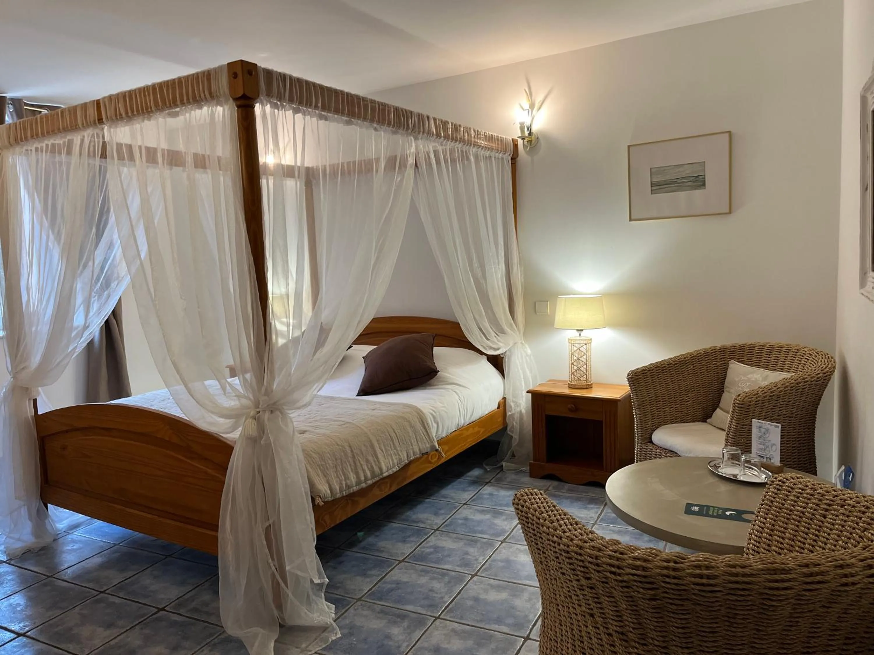 Living room, Bed in Logis Hôtel La Bastide des Monges