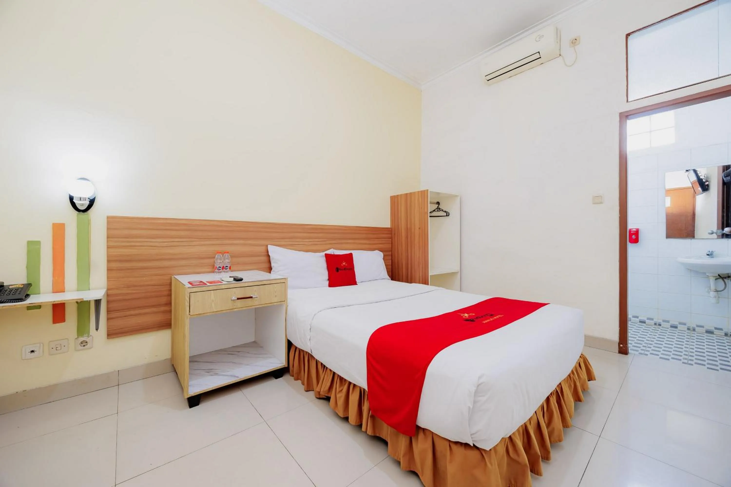 Bedroom, Bed in RedDoorz Plus at Amalio Hotel Surapati