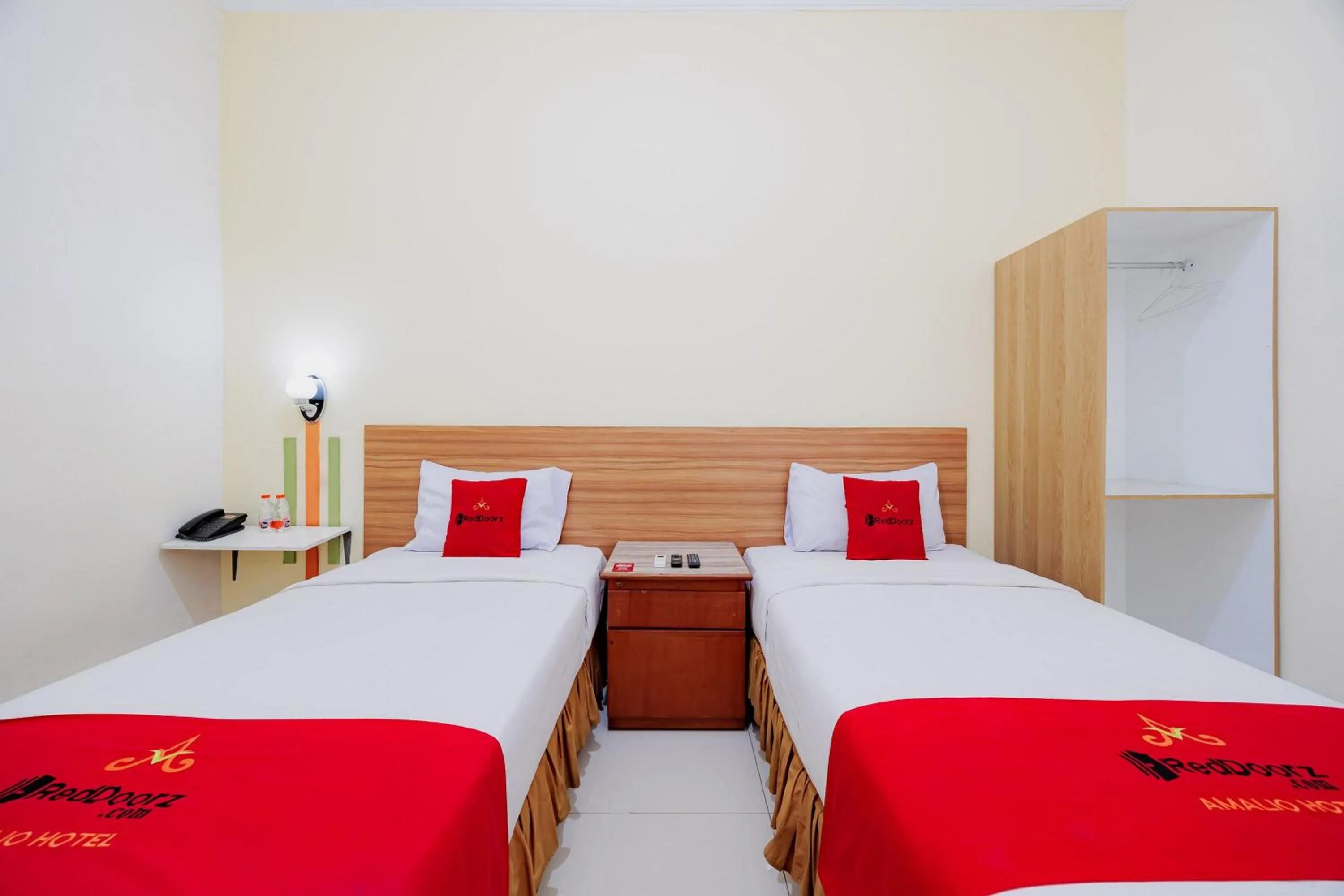 Bedroom, Bed in RedDoorz Plus at Amalio Hotel Surapati