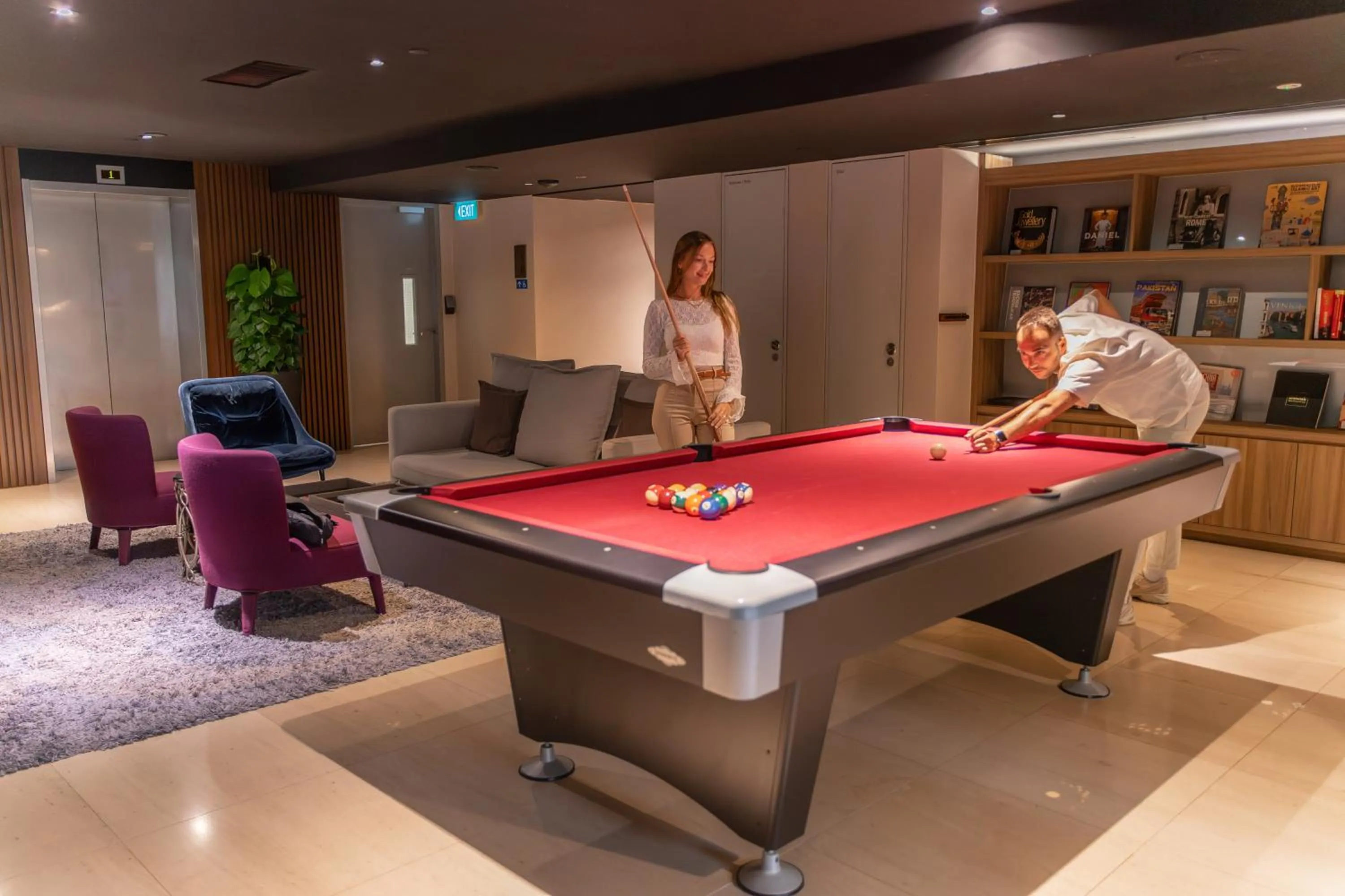 Communal lounge/ TV room in Pan Pacific Serviced Suites Beach Road, Singapore