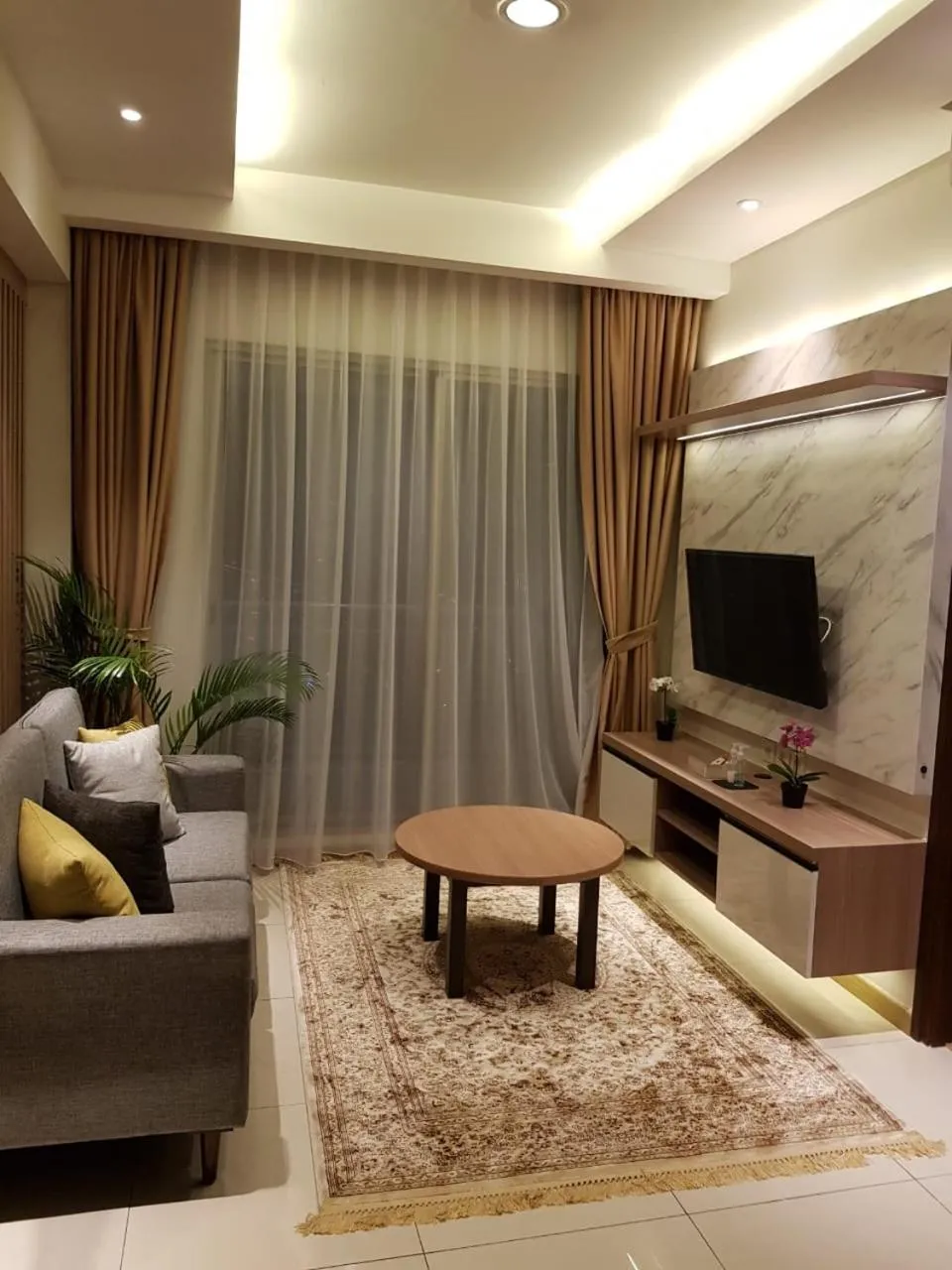 TV and multimedia in M-Town Signature Gading Serpong by J`s Luxury Apartment