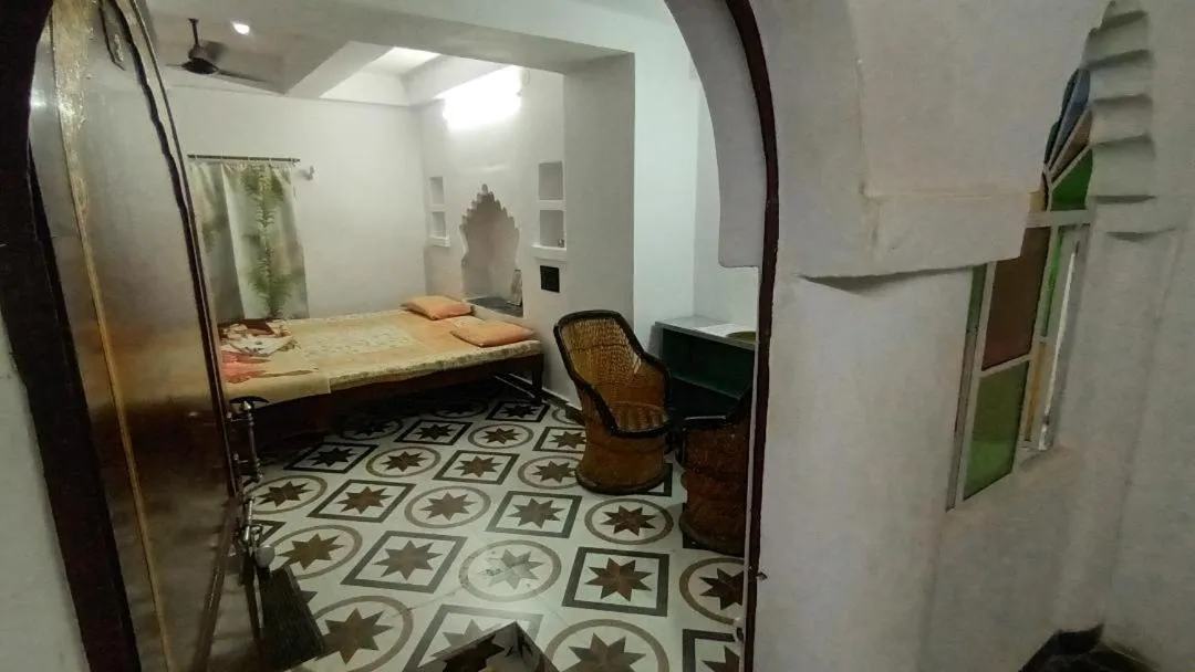 Photo of the whole room, Bed in Jag Niwas Guest House & pure veg restaurant
