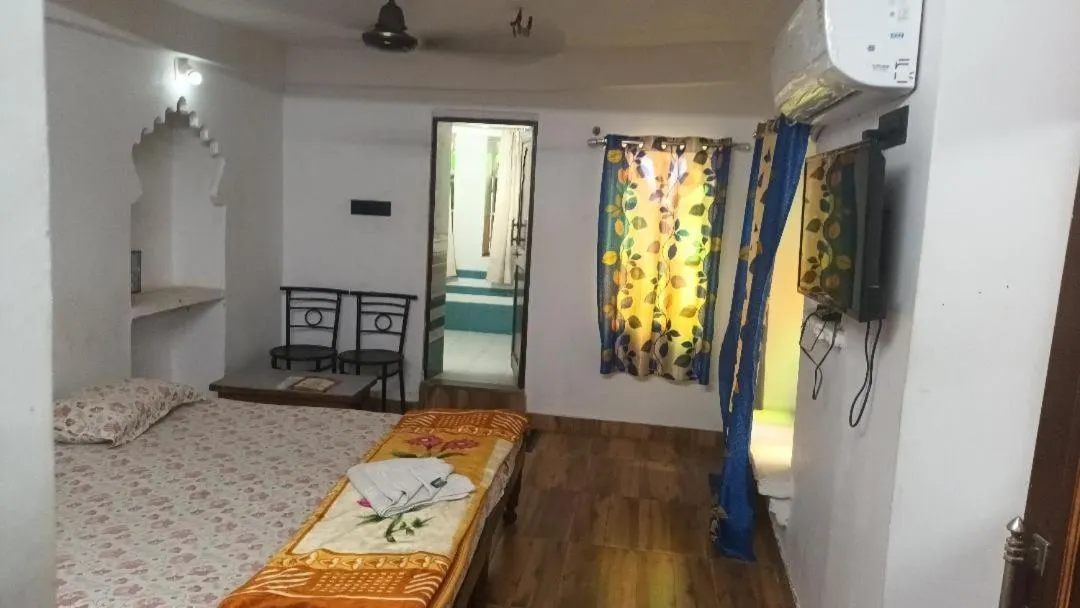 Photo of the whole room, Bed in Jag Niwas Guest House & pure veg restaurant